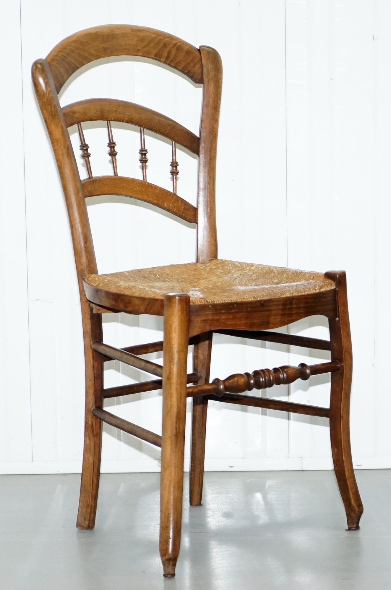 We are delighted to offer for sale this stunning set of four Arts & Crafts walnut rush seat dining chairs in the style of the original William Morris Sussex chair.

These chairs are a style and design classic, the William Morris Sussex chair is