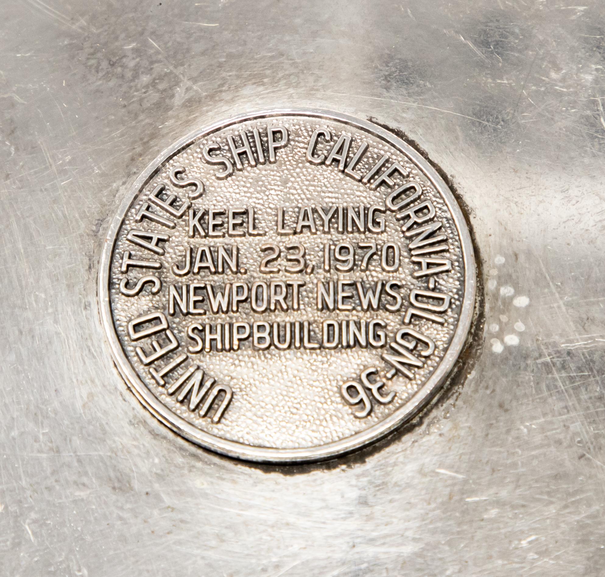 Offering this beautiful silver plate plaque by William A Rogers and Co. The Medallion in the middle is marked United States Ship California- DLGN-36 around the edge. The center has the name Keel Laying, Jan 23, 1970, Newport News, Shipbuilding. The
