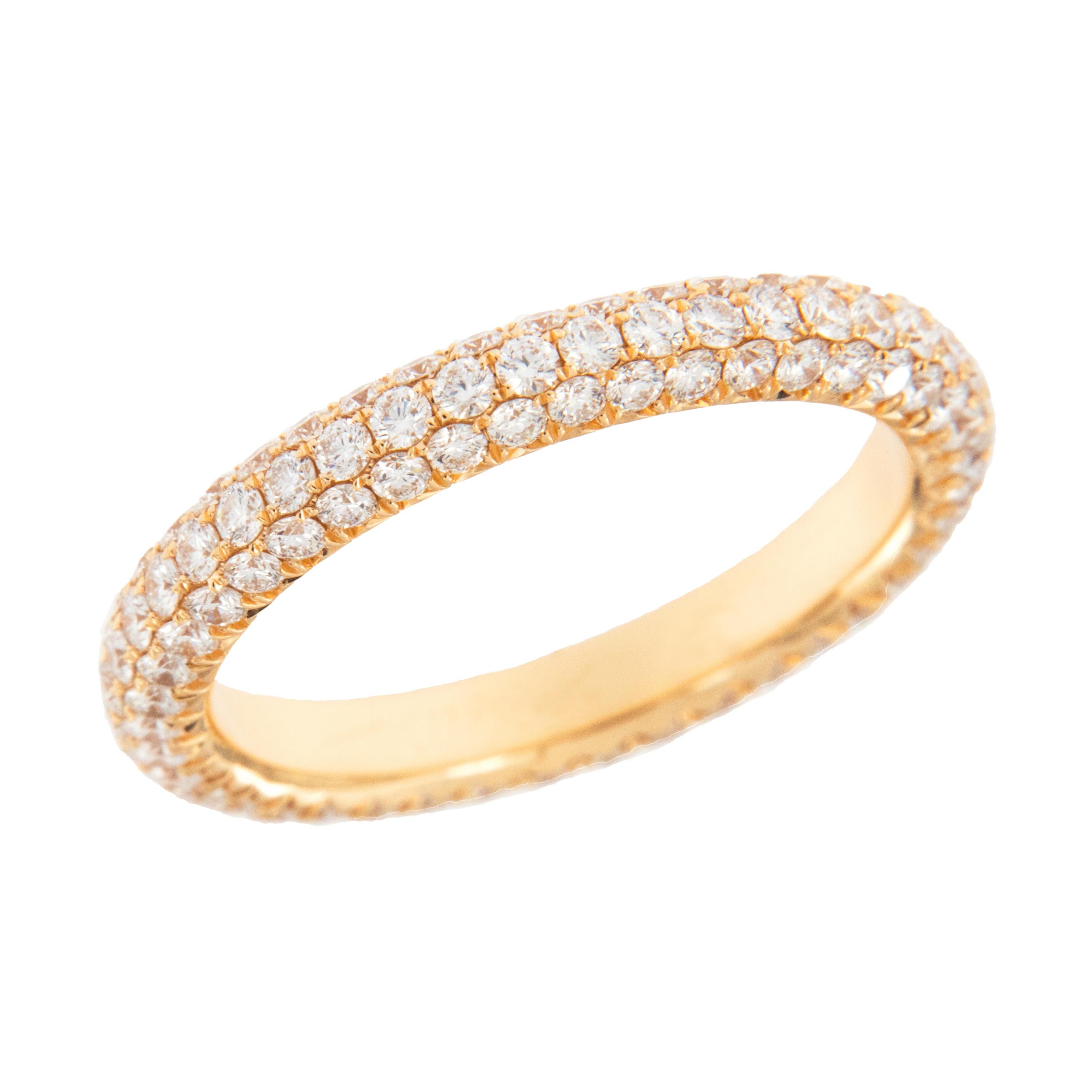 Expertly crafted eternity band by William Rosenberg made from 18 karat regal rose gold with 3 row pave' set round brilliant diamonds = 1.51 Cttw. These exceptional diamonds are of VS clarity & D-F color. This ring was made in a size 6 but can be