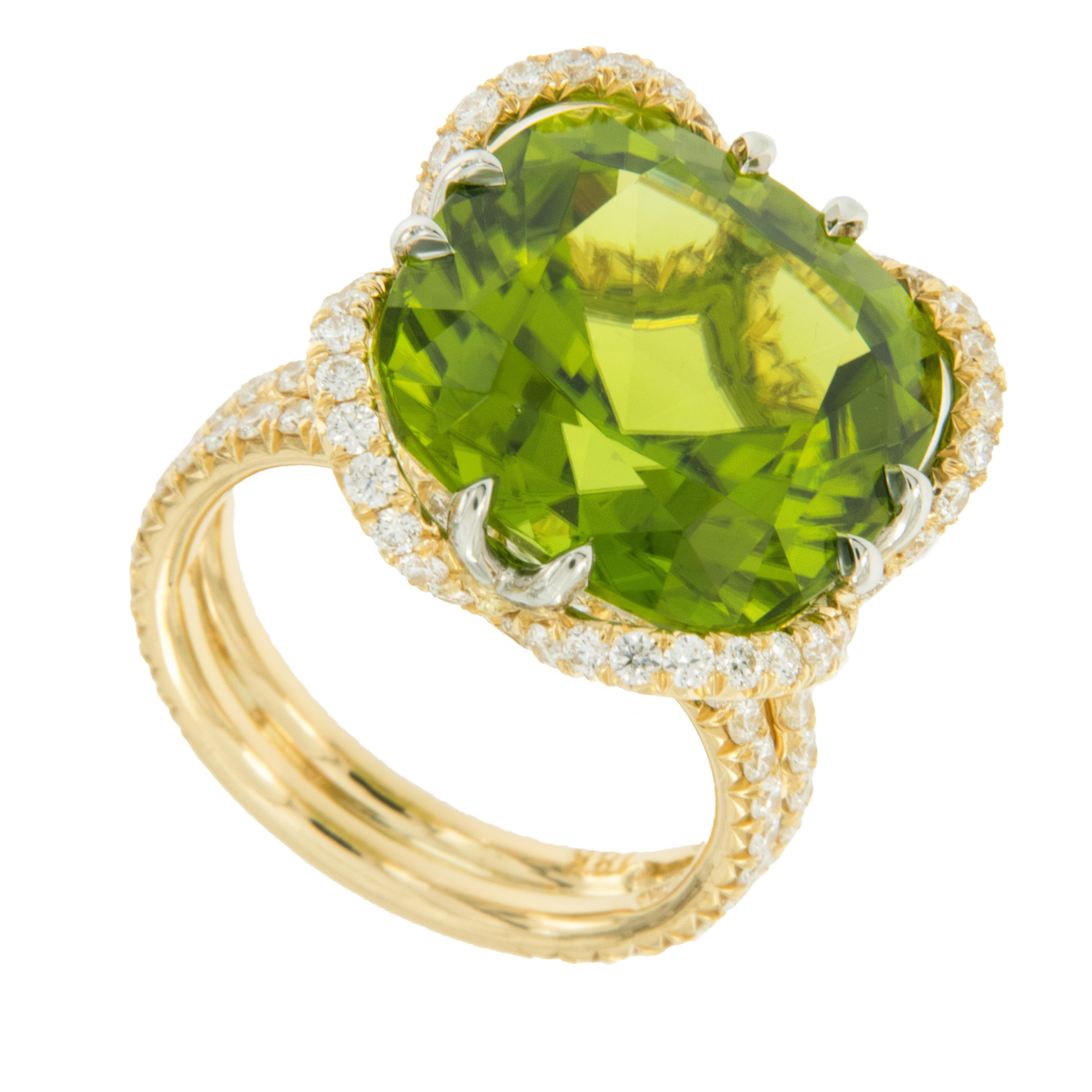 Peridot is the only other gem that shares their volcanic ride to the earths surface with diamonds! Peridot's over 5 carats are rare, so imagine how rare this AGL certified 17.14 Carat Peridot is! Nestled in the 1.90 Cttw D-E VVS diamond encrusted