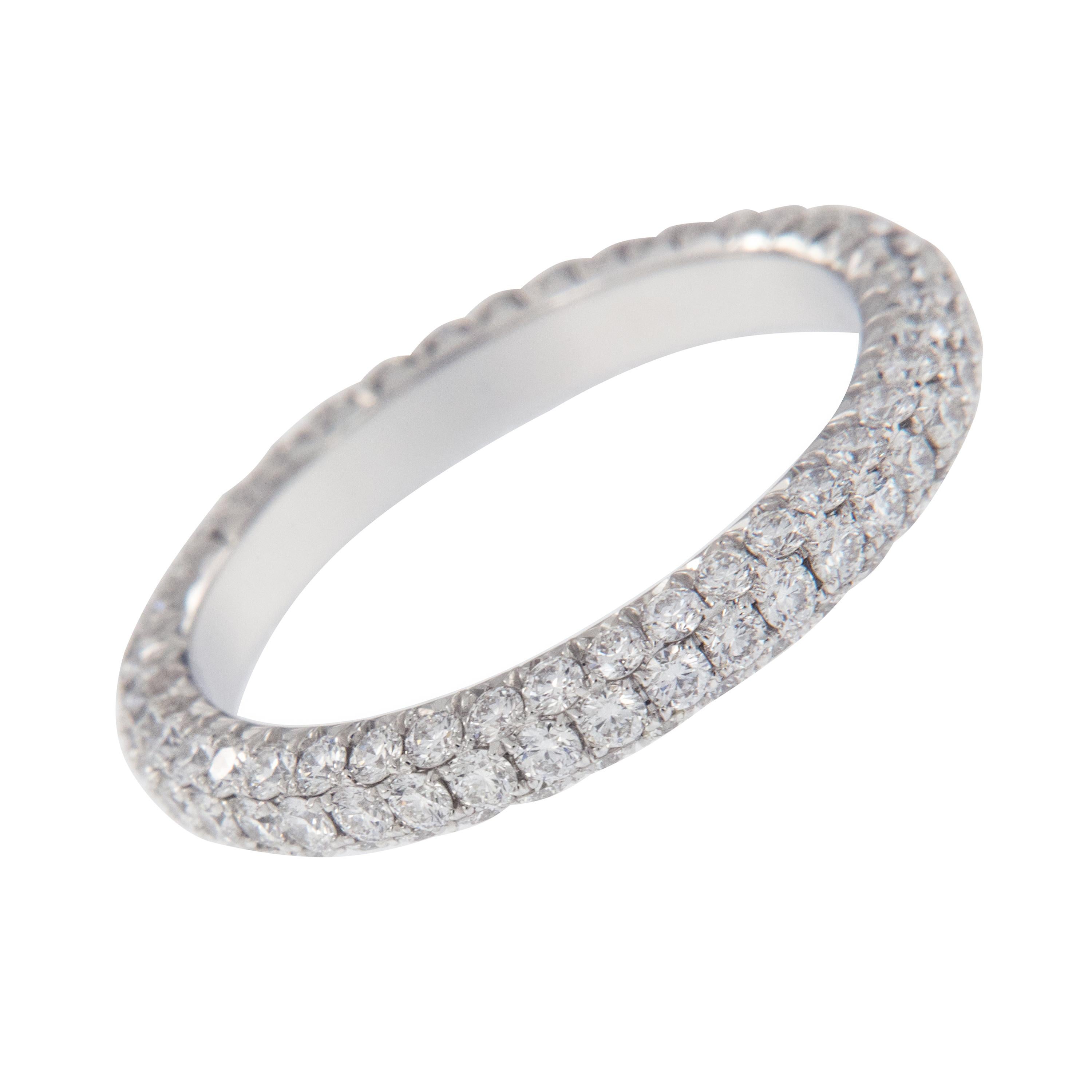 Expertly crafted eternity band by William Rosenberg made from noble platinum with 3 row pave' set round brilliant diamonds = 1.49 Cttw. These exceptional diamonds are of VS clarity & D-F color. This ring was made in a size 6 but can be custom made