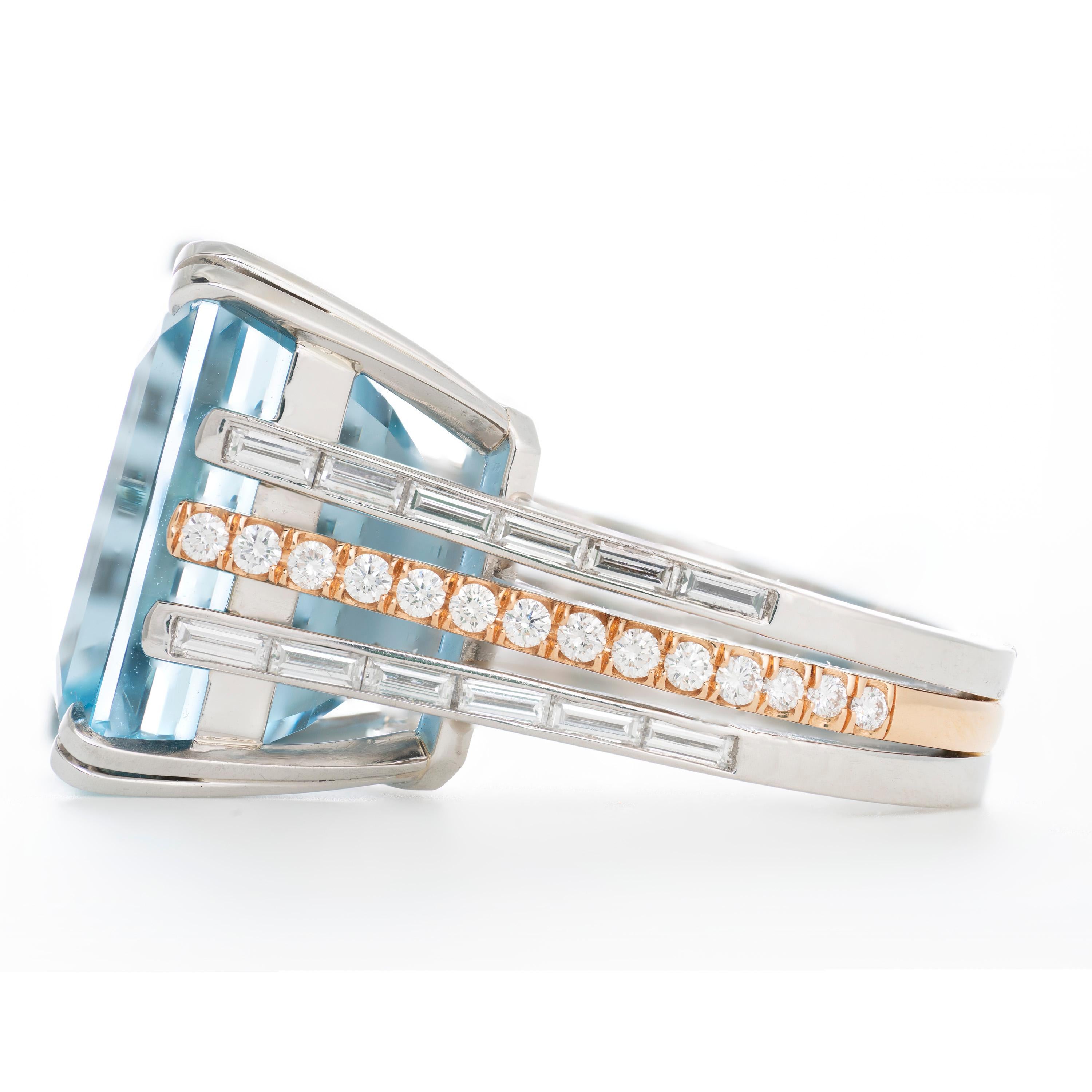 Expertly crafted in platinum & 18 karat rose gold by William Rosenberg, this stunning ring features a 25.67 carat emerald cut Aquamarine that was mined from the famous Santa Maria mine in the state of Minas Gerais, Brazil. The mine was discovered in