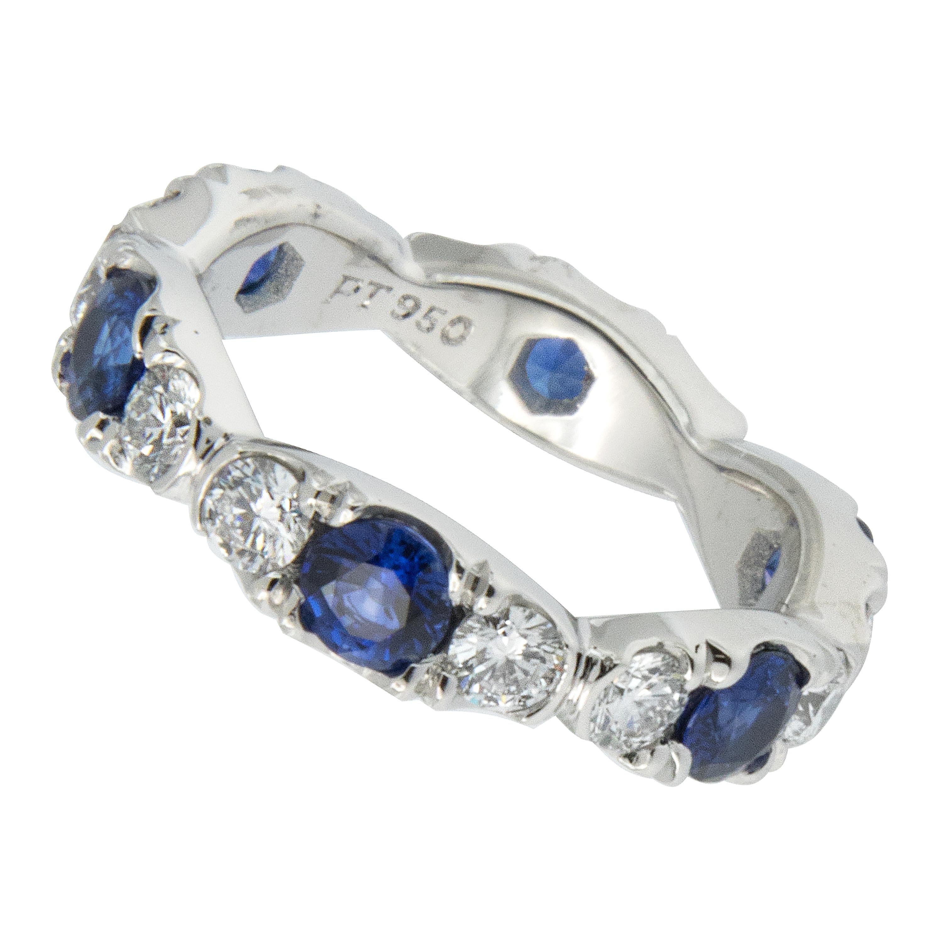 Expertly hand fabricated eternity band by William Rosenberg made from noble metal platinum with 1.71 Cttw blue sapphires & 1.03 Cttw diamonds showing hearts & arrows of VVS clarity & F color. This scalloped ring was made in a size 6 but can be