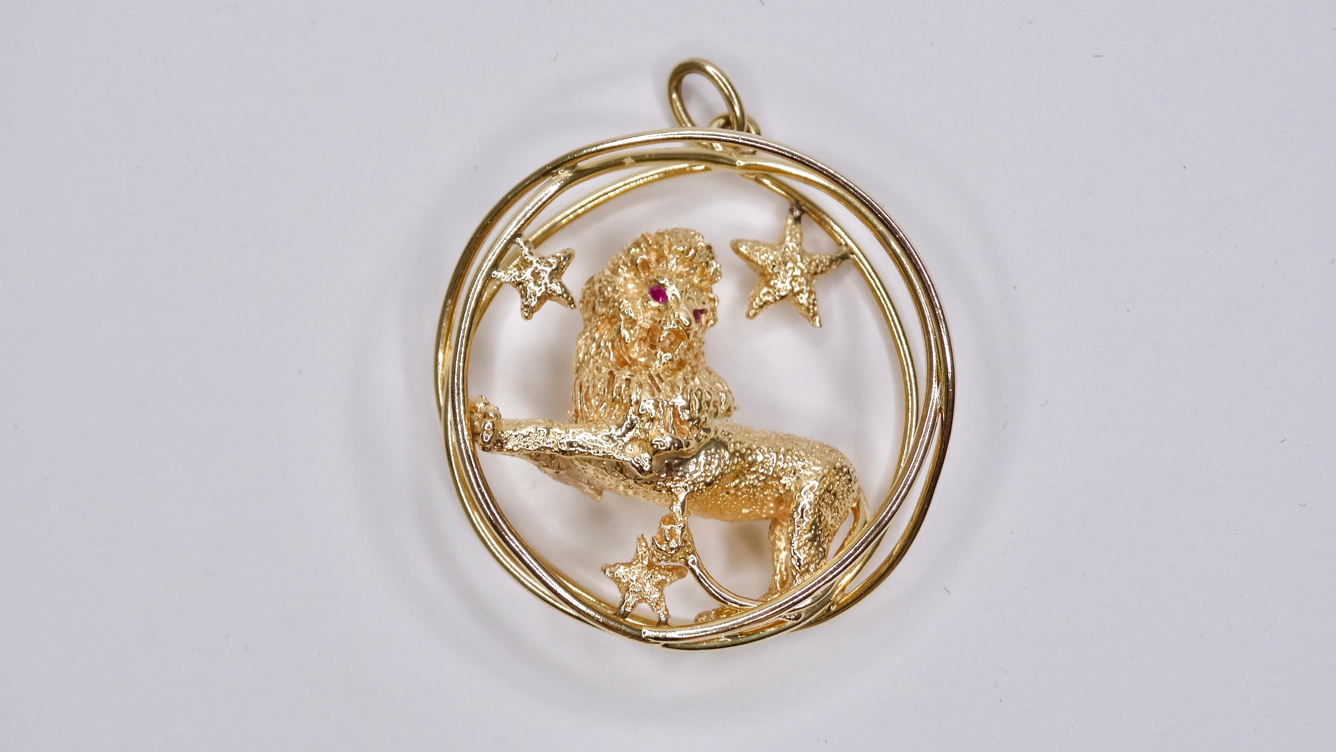 Add a little zodiac flair to your outfit! This is a large 14K gold Leo the lion charm/pendant, made and signed by William Ruser. It features a textured three-dimensional body, ruby eyes, surrounded by three stars. This lion is powerful and full of