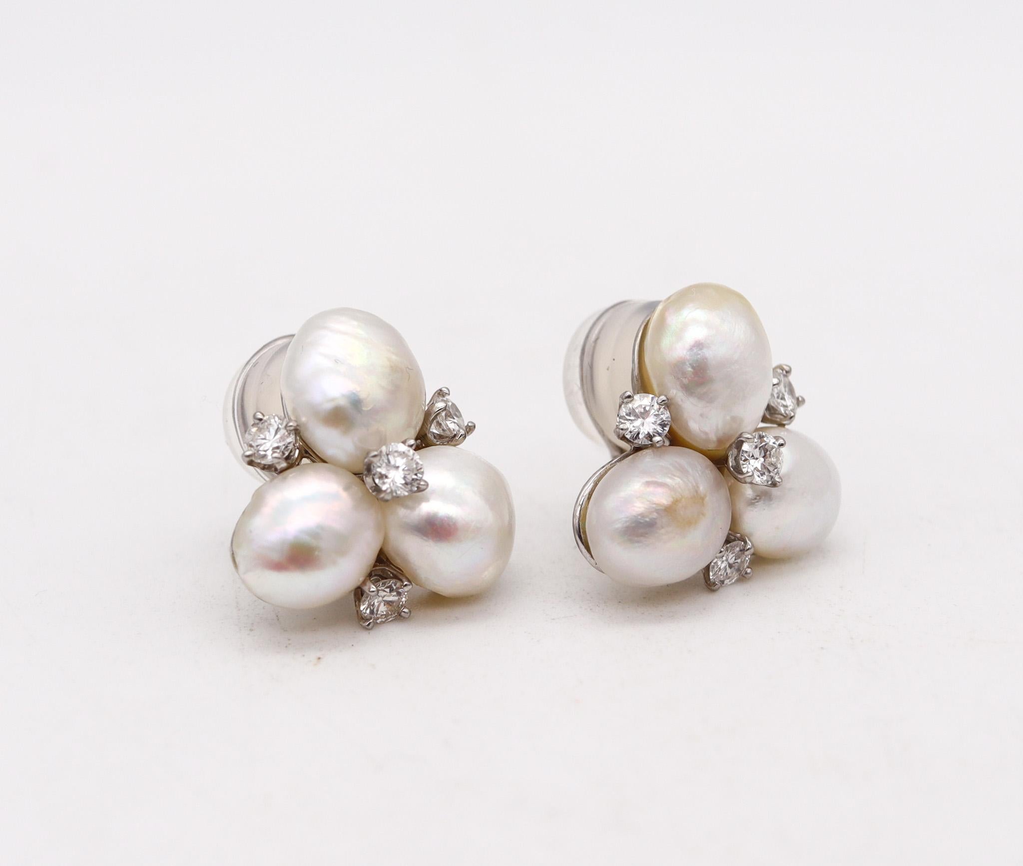 Clip on earrings with natural pearls designed by William Ruser.

Beautiful pair of clips earrings, created in Beverly Hill California back in the 1950 by William Ruser. These pieces has been crafted with classic design in solid .900/.999 platinum