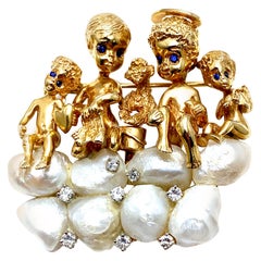 William Ruser Engel mit Kindern und Hund auf einer Wand aus Perlen und Diamanten sitzend