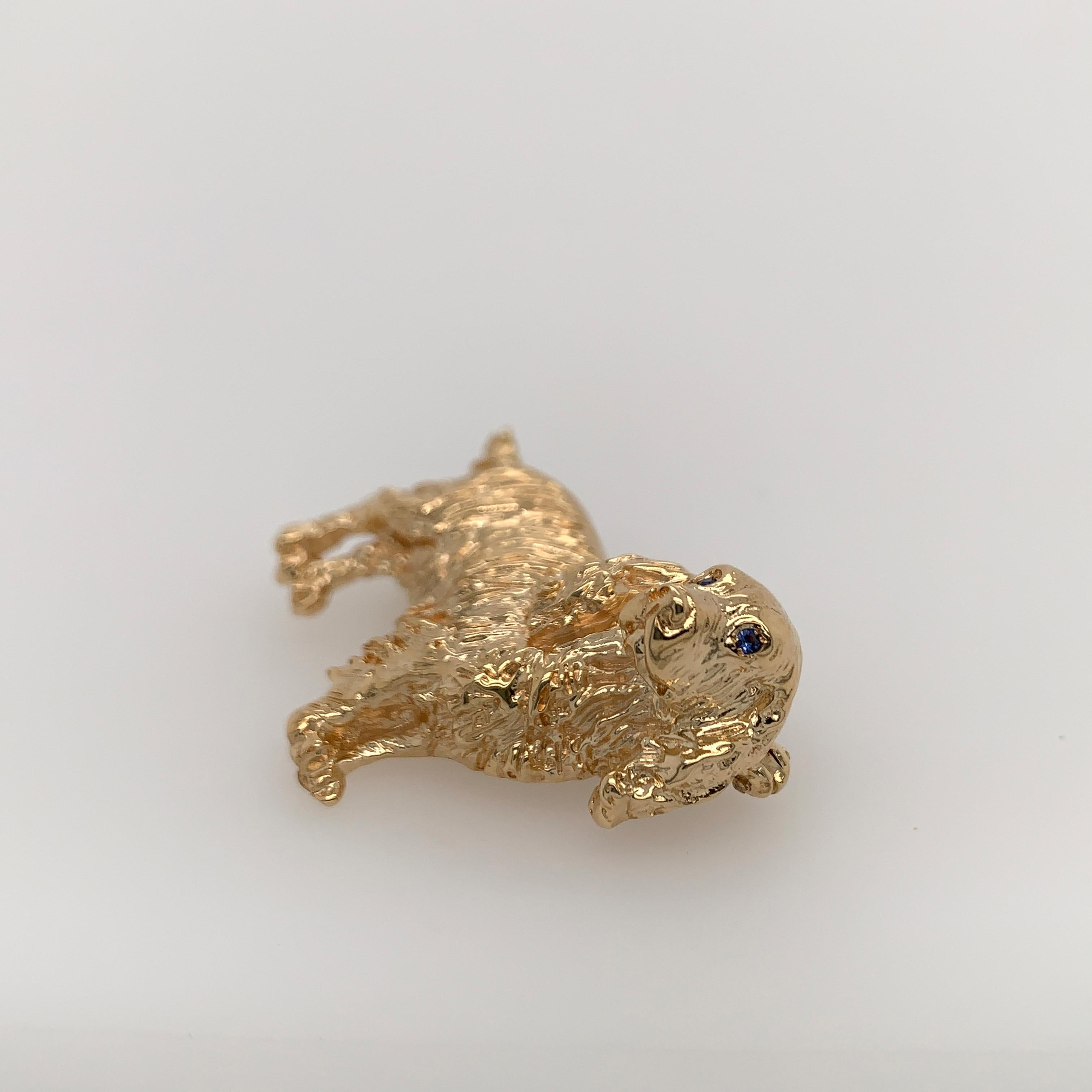 14K yellow gold adorable cocker spaniel brooch designed and fabricated by William Ruser, circa 1960's. This pup is watching you through sapphire eyes! Weight is 14.5 grams.