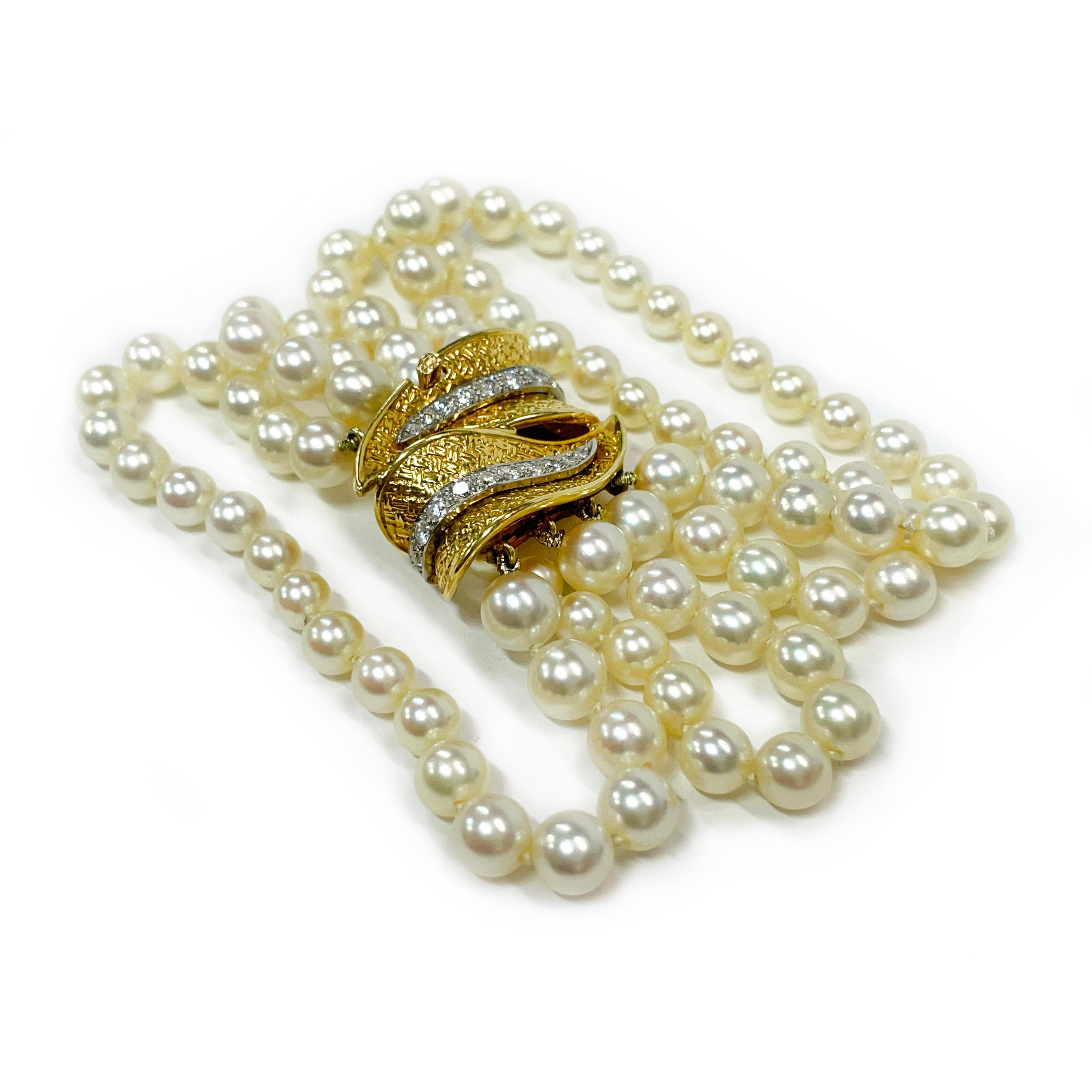 18 Karat Yellow Gold Platinum Four-Strand Pearl Diamond Bracelet. Absolutely lovely four-strand pearl bracelet with a double yellow gold leaf design with diamond accents set in platinum. The bracelet features twenty diamonds ranging in size from