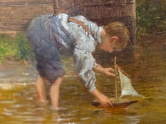 Boy Sailing Toy Boat in Creek, oil on canvas in gilt frame signed and dated 1897
