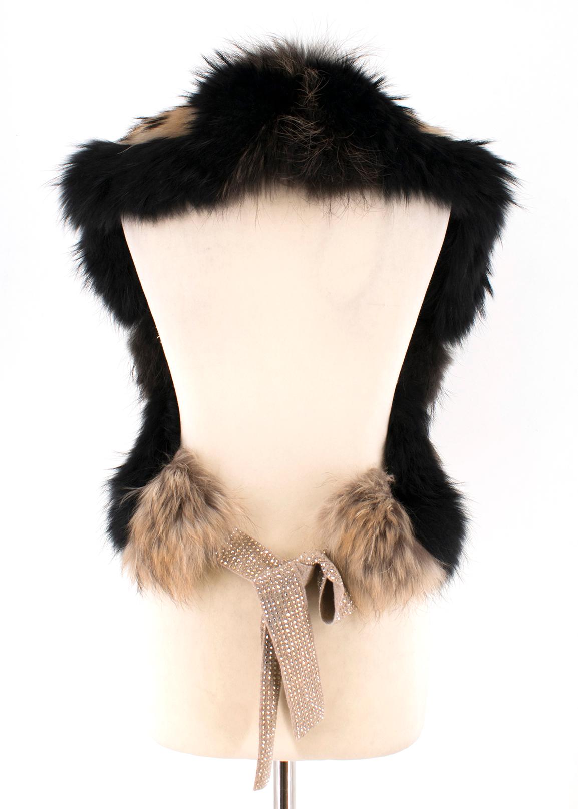 William Sharp fox fur shawl 

- Black and tonal-brown with black tips, mid-weight patchwork fox fur 
- Beige knit self-fastening ties, Swarovski yellow crystal embellished 
- Black satin lining
- Can be worn off the shoulder 

Please note, these