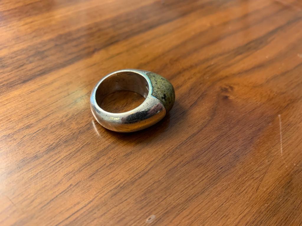 A rare Mexican Mid-Century Modern sterling silver ring by William Spratling. The domed design has a green jasper inlay. Sealed on the interior.

Provenance: This was a gift from Mexican painter and muralist Carlos Orozco Romero to the previous