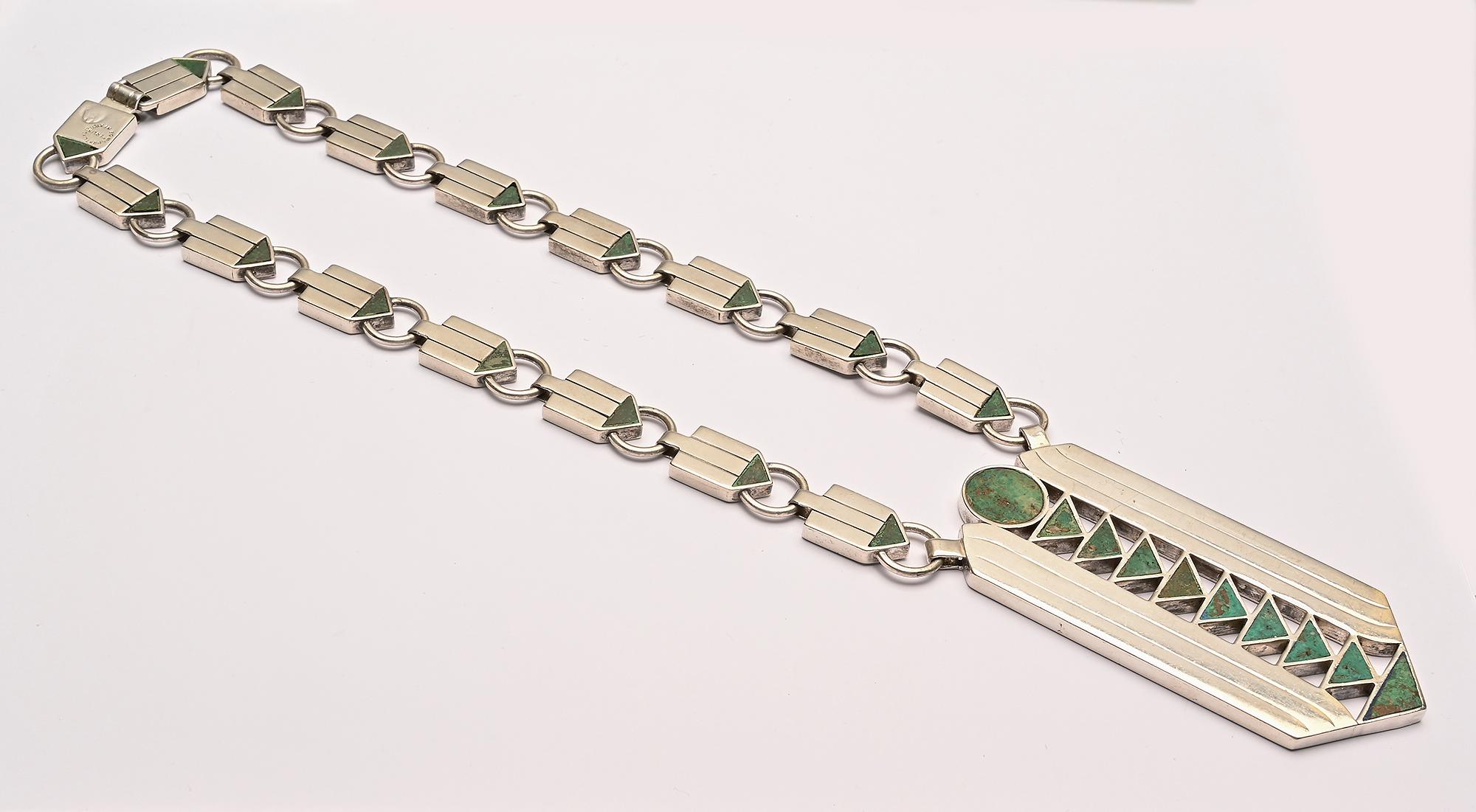Sterling silver with azure malachite arrows necklace by the father of the Mexican jewelry design movement, William Spratling. Circles, rectangles and triangles are combined to make a dense yet open overall design. The necklace chain measures 17