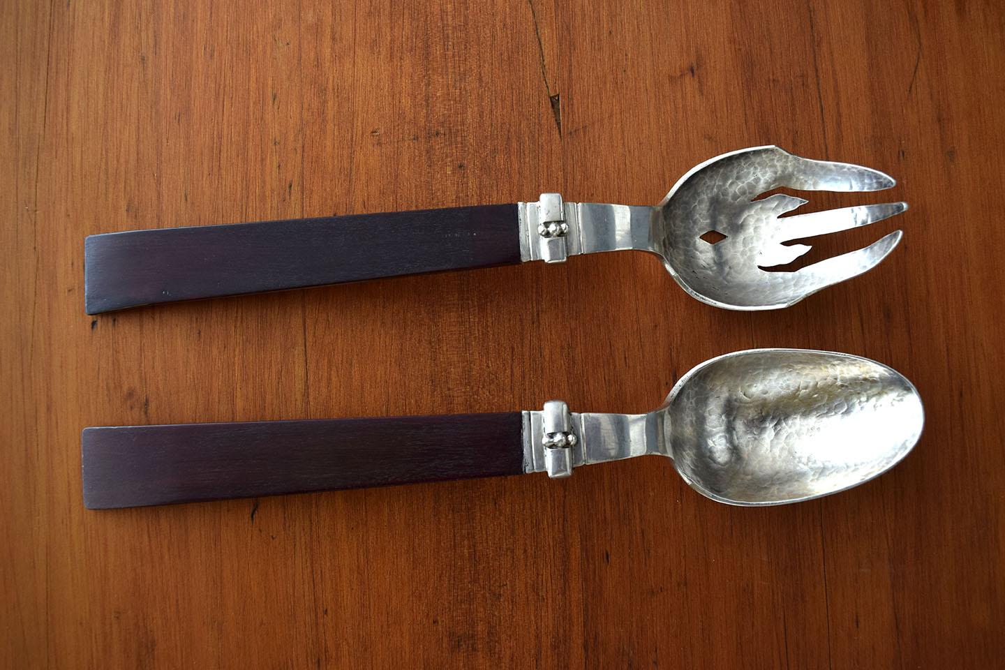 Silver and wood set of salad servers design by William Spratling.
