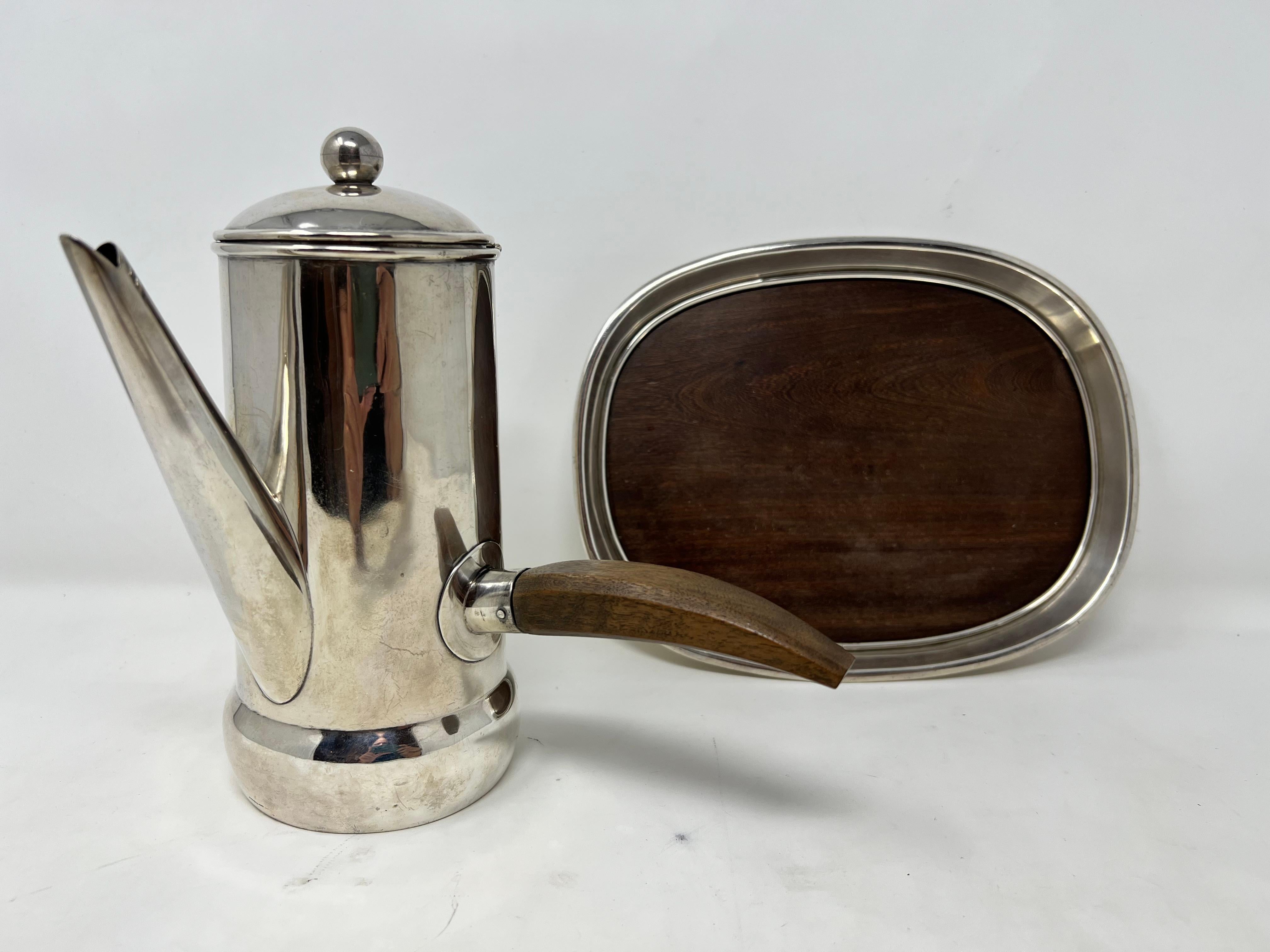 William Spratling Silver Coffee Pot and Serving Tray.
The tray measures 9 inches long, 4 inches wide and 1 inch high.