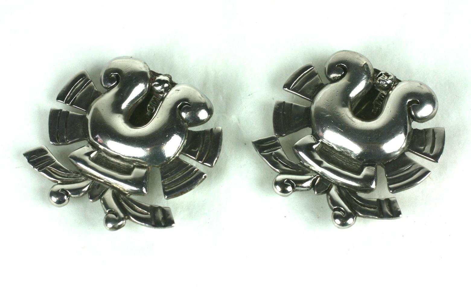 William Spratling Sterling Dress Clips from the Art Deco period. Traditional Mexican motifs used for these elegant hand raised designs. Can be worn on lapel, neckline, scarf or pocket edge.
Early 
