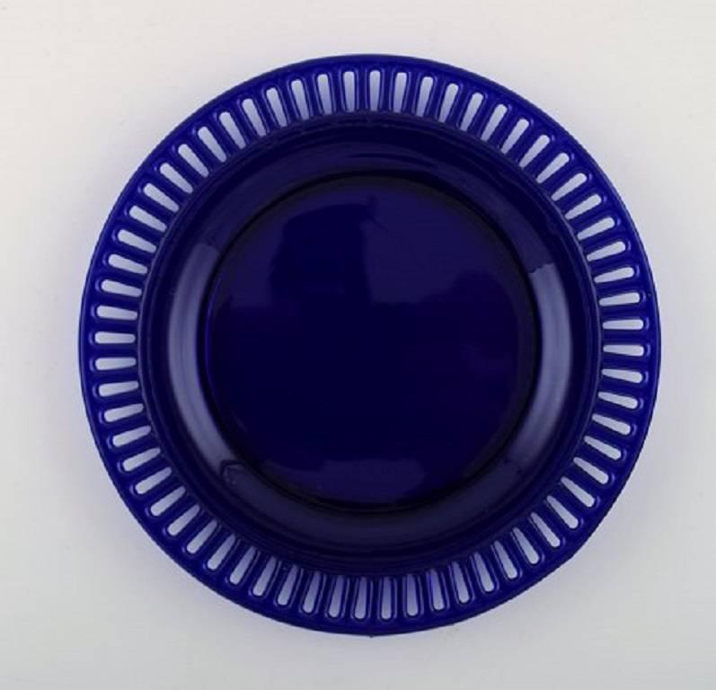 Scandinavian Modern William Steberg for Gullaskuf, Seven Plates and Bowls in Dark Blue Art Glass For Sale