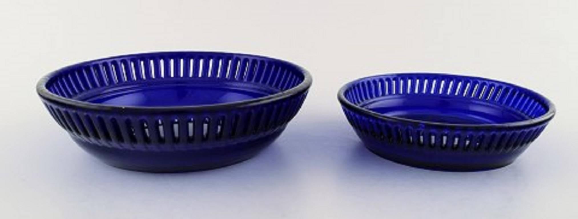 Swedish William Steberg for Gullaskuf, Seven Plates and Bowls in Dark Blue Art Glass For Sale