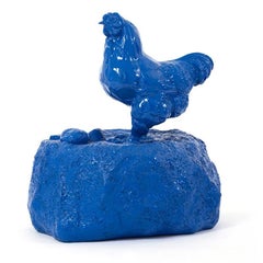 Chicken on rock.