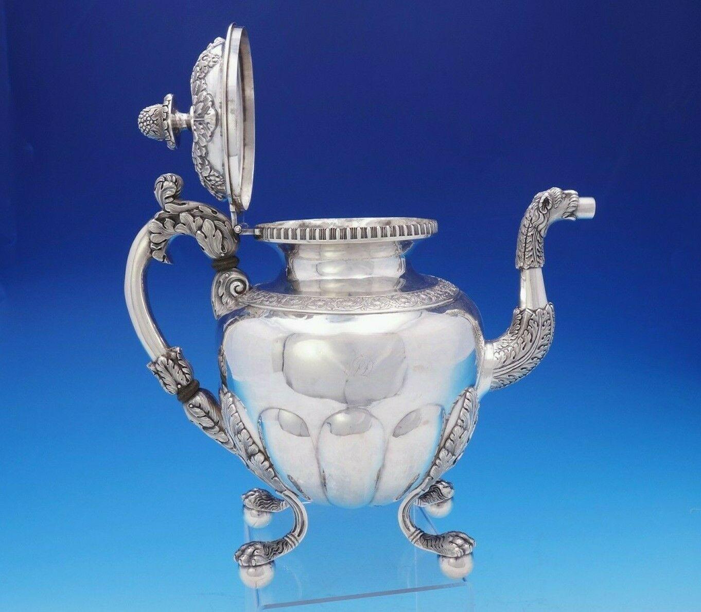 William Thomson

Stunning William Thomson coin silver 4-piece tea set with elaborate floral and acanthus leaf design. It was made in New York circa 1809-1845, and features applied lion's paw on ball feet and berry/grape finial. This set includes:

1