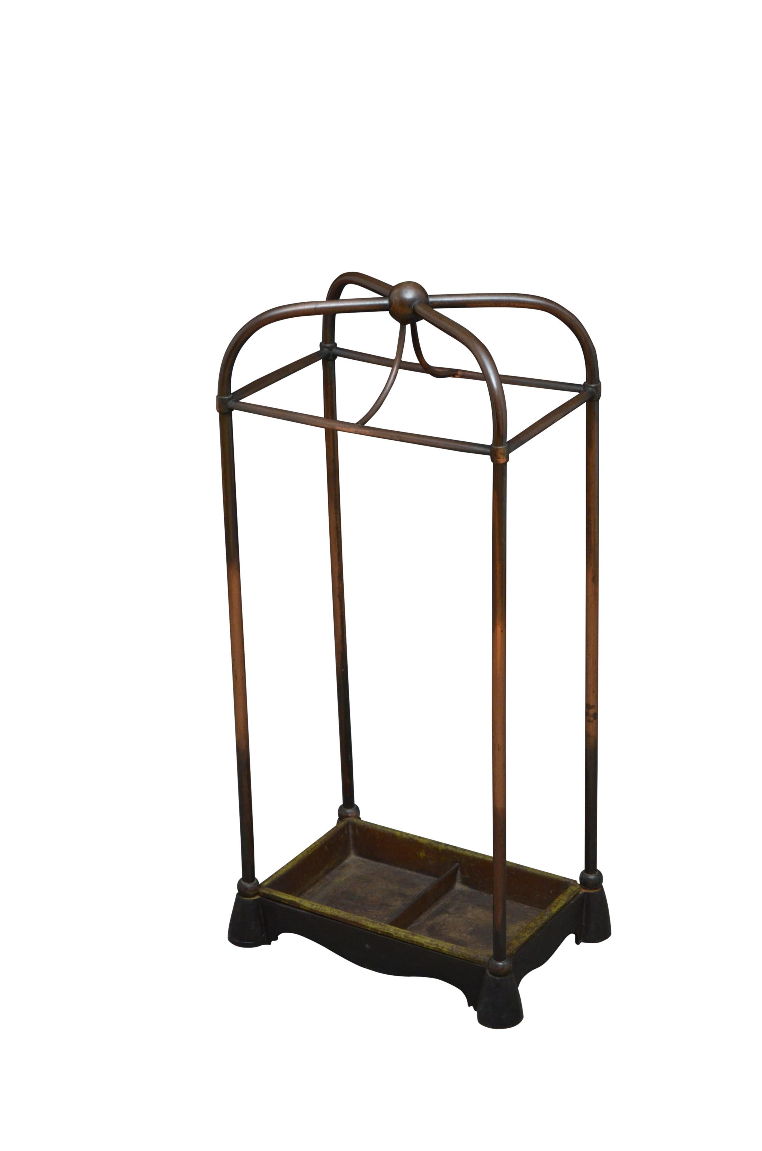 Stylish Victorian brass, copper plated umbrella stand by William Tonks and Sons, all in excelled original condition retaining its patina and removable cast iron drip tray. Stamped W. T & S. c1880
Manufacturer of architectural hardware, art