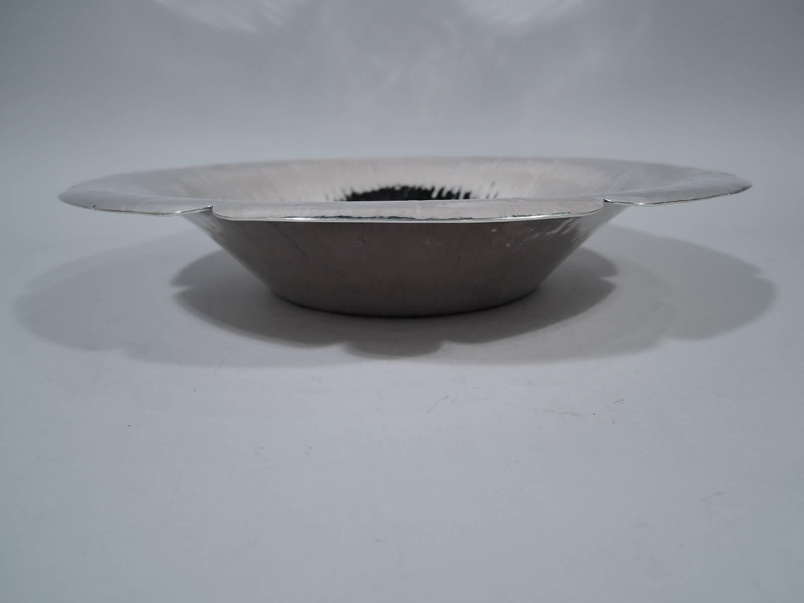 Large handmade sterling silver centerpiece bowl. Made by William Waldo Dodge Jr in Asheville, North Carolina. Plain circular well. Sides curved and flared with shimmering striation. Rim has shallow scallops. An interesting design that is sometimes