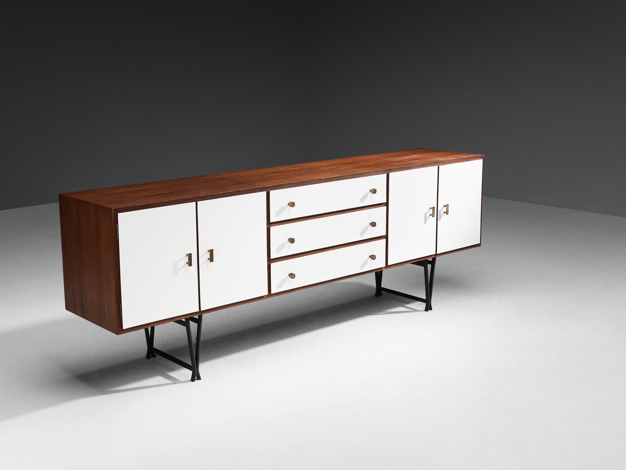 William Watting for Fristho, sideboard, teak, brass, lacquered wood, Netherlands, 1950s. 

Elegant sideboard designed by William Watting for Fristho from the fifties. Very slim tapered lacquered metal legs that come together in two triangle shapes