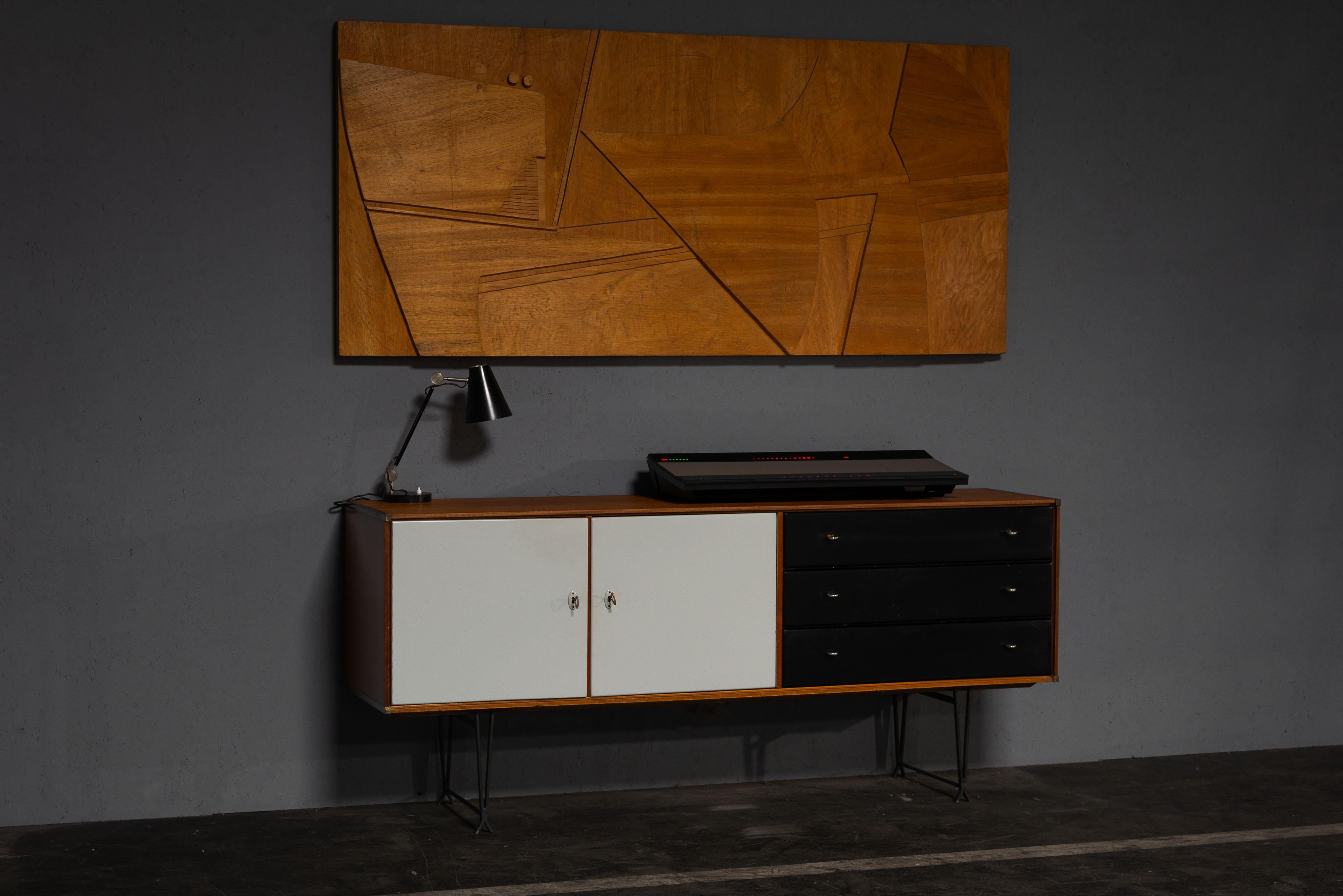 Very nice and rare small sideboard designed by William Watting and manufactured by Fristho Franeker, The Netherlands 1954. Made from teak wood, it features stylish black drawers and grey-painted door fronts, giving it a unique and modern look.