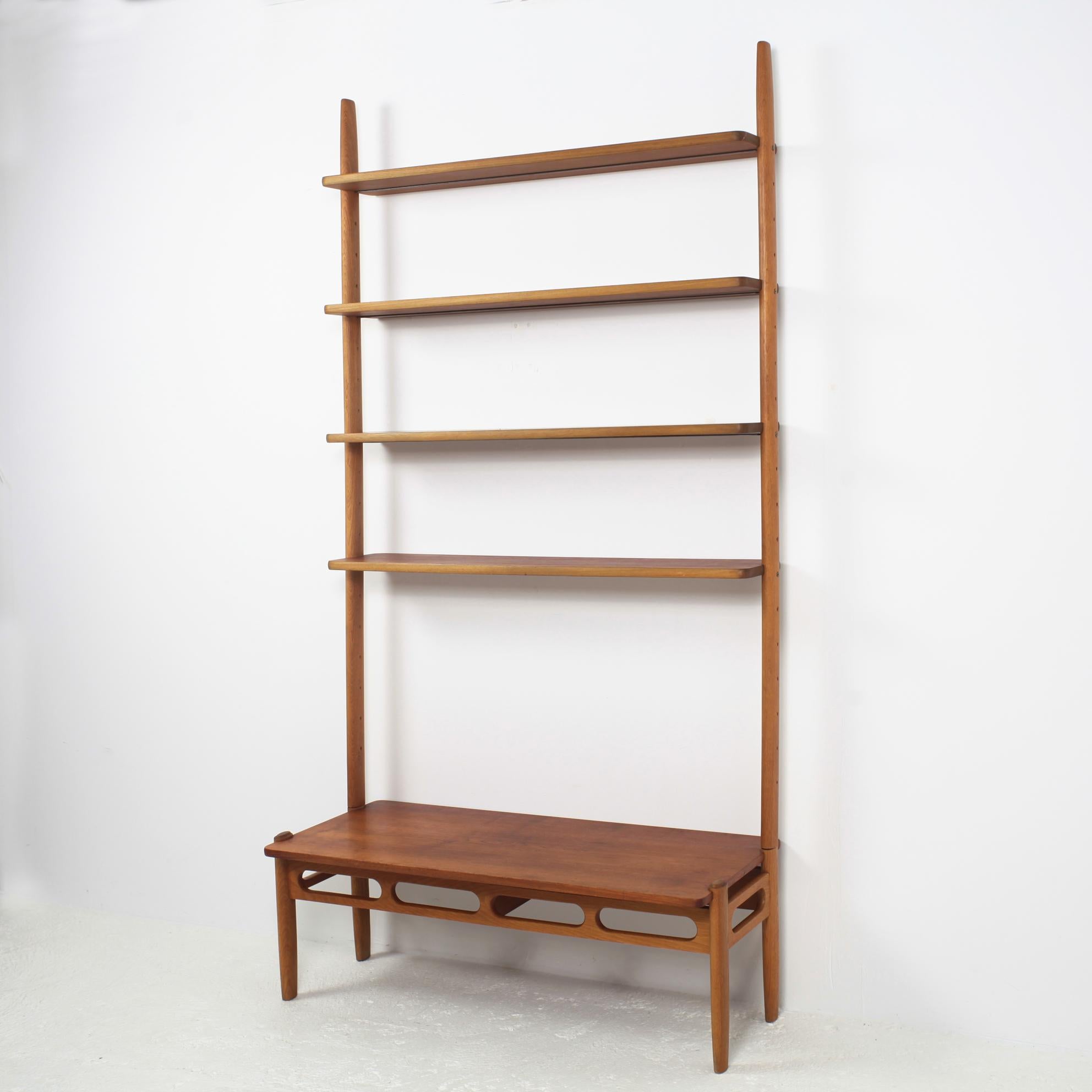 Light and aerial shaped modular bookshelves, solid teak board and solid oak structure
designed by William Watting for A/S Mikael Laursen, 1950, Denmark.