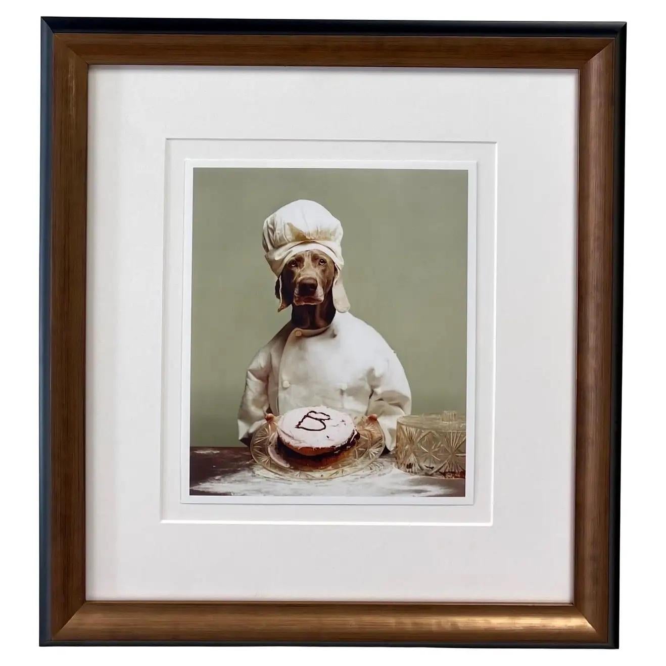William Wegman ( American, 1943) original limited edition color photography titled "B for Baker " inspired by nursery rhyme "Pat a cake" from William Wegman's mother Goose series 1996-2012. The art work comes with a certificate of authenticity