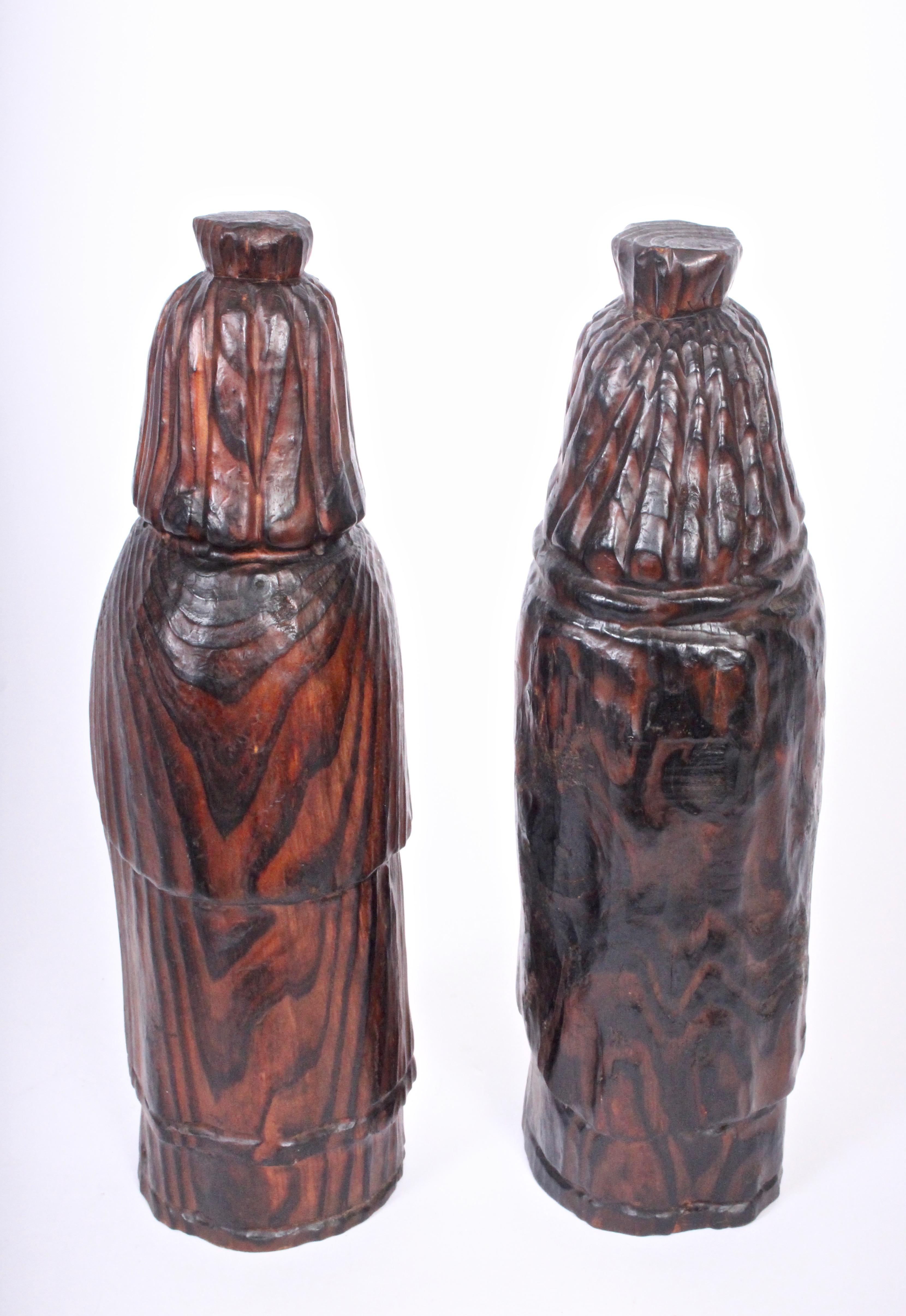 Pair of King & Queen hand carved wooden bottle cozies by William Westenhaver/ WITCO. Sculptural handcrafted stained finely grained wooden figurines created in his Mt. Vernon, Washington studio. Covers 12
