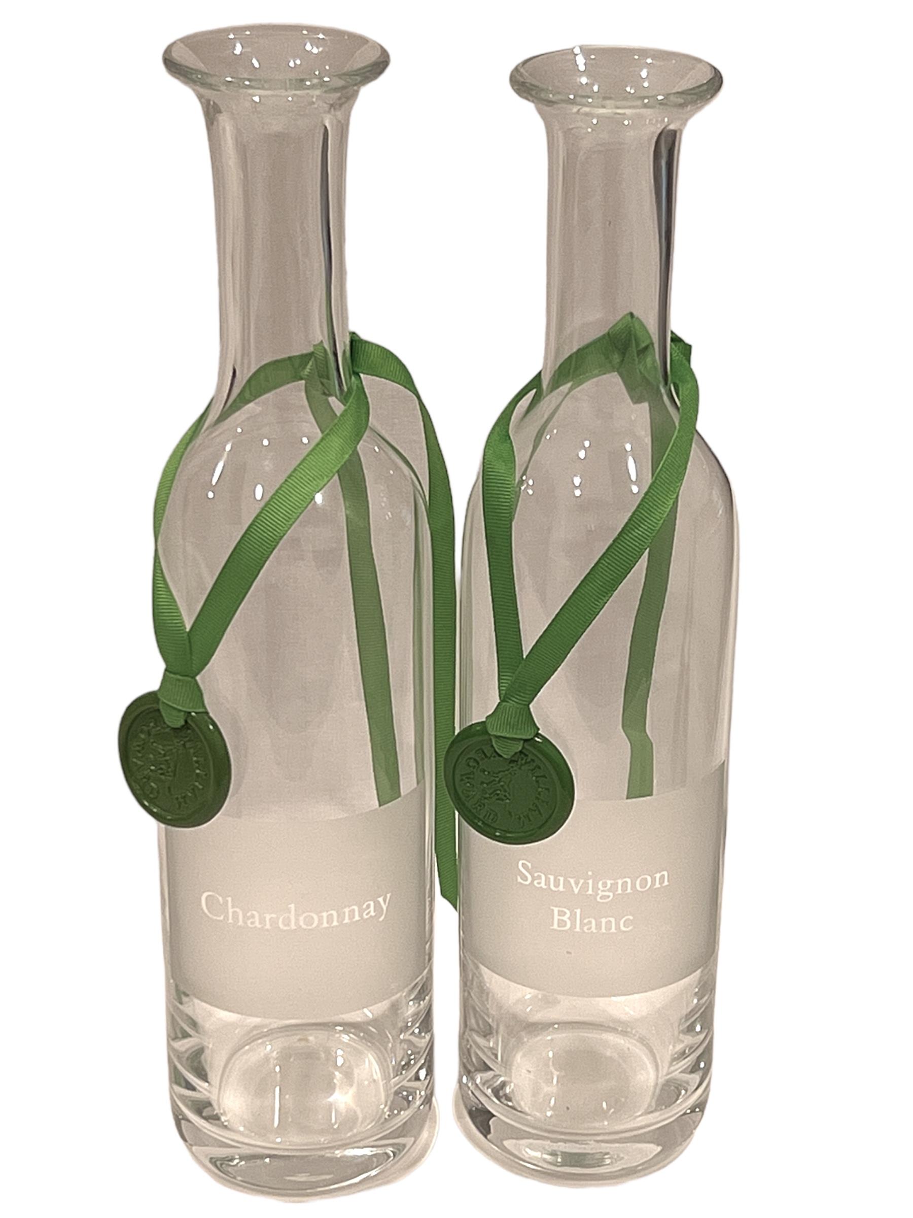 These simple, elegant and classic carafes feature a deeply engraved wine label that reads “Merlot” & “Pinot Noir” on a frosted square; hand made of the finest, lead-free glass, these beautiful carafes are sure to elevate your entertaining to the