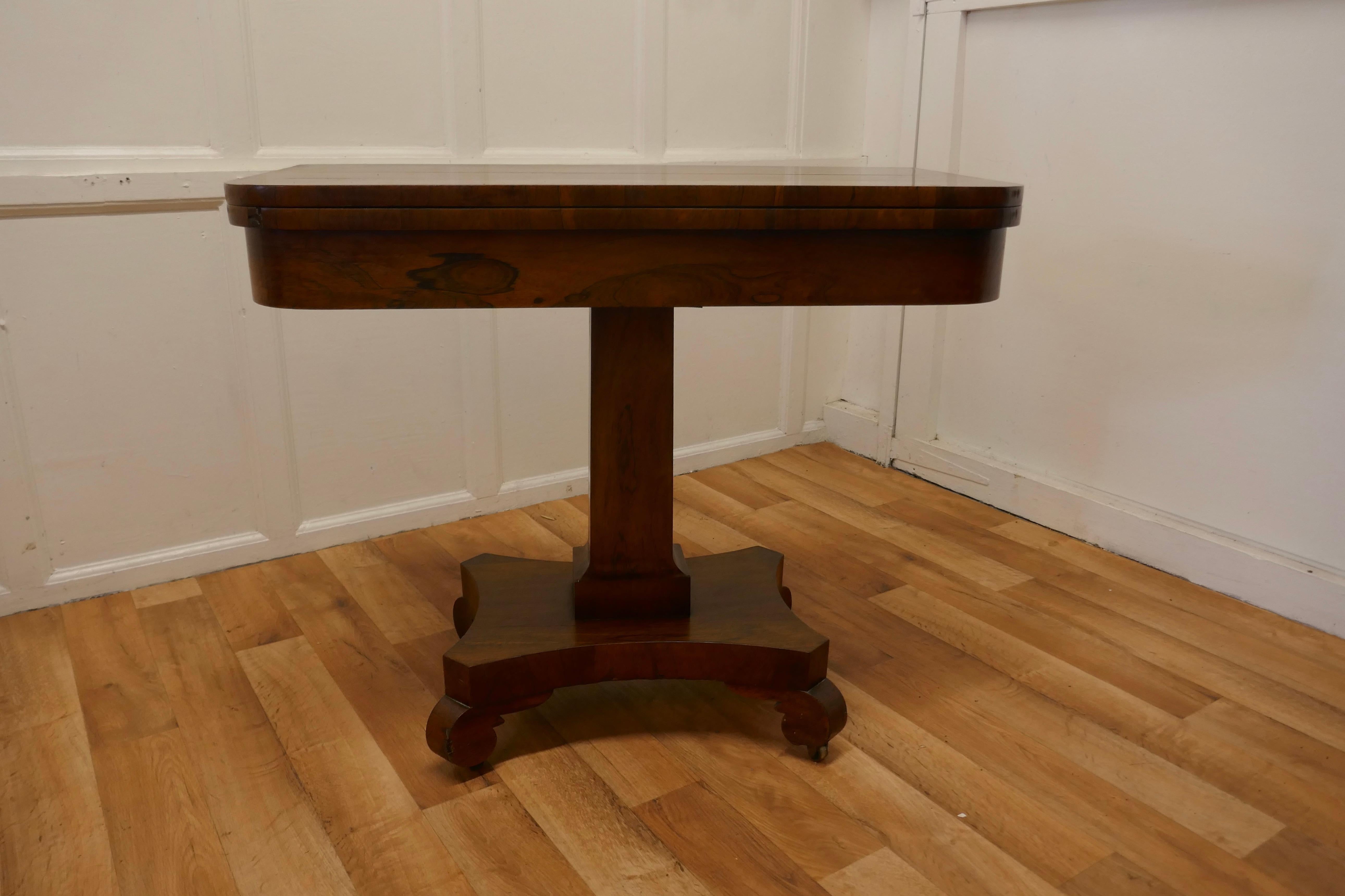 William IV folding games or card table.

This is a good quality piece with beautiful patina, it takes up little space and unfolds to a 3ft square games table.
The base has a 4 point base with scroll feet and the top swivels to open out.

The