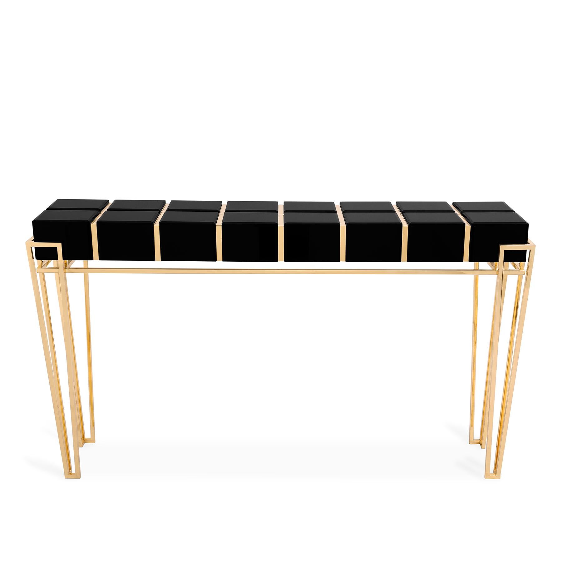 Console Williams with solid brass structure in polished
brass, with wooden body covered with blackened glass top.