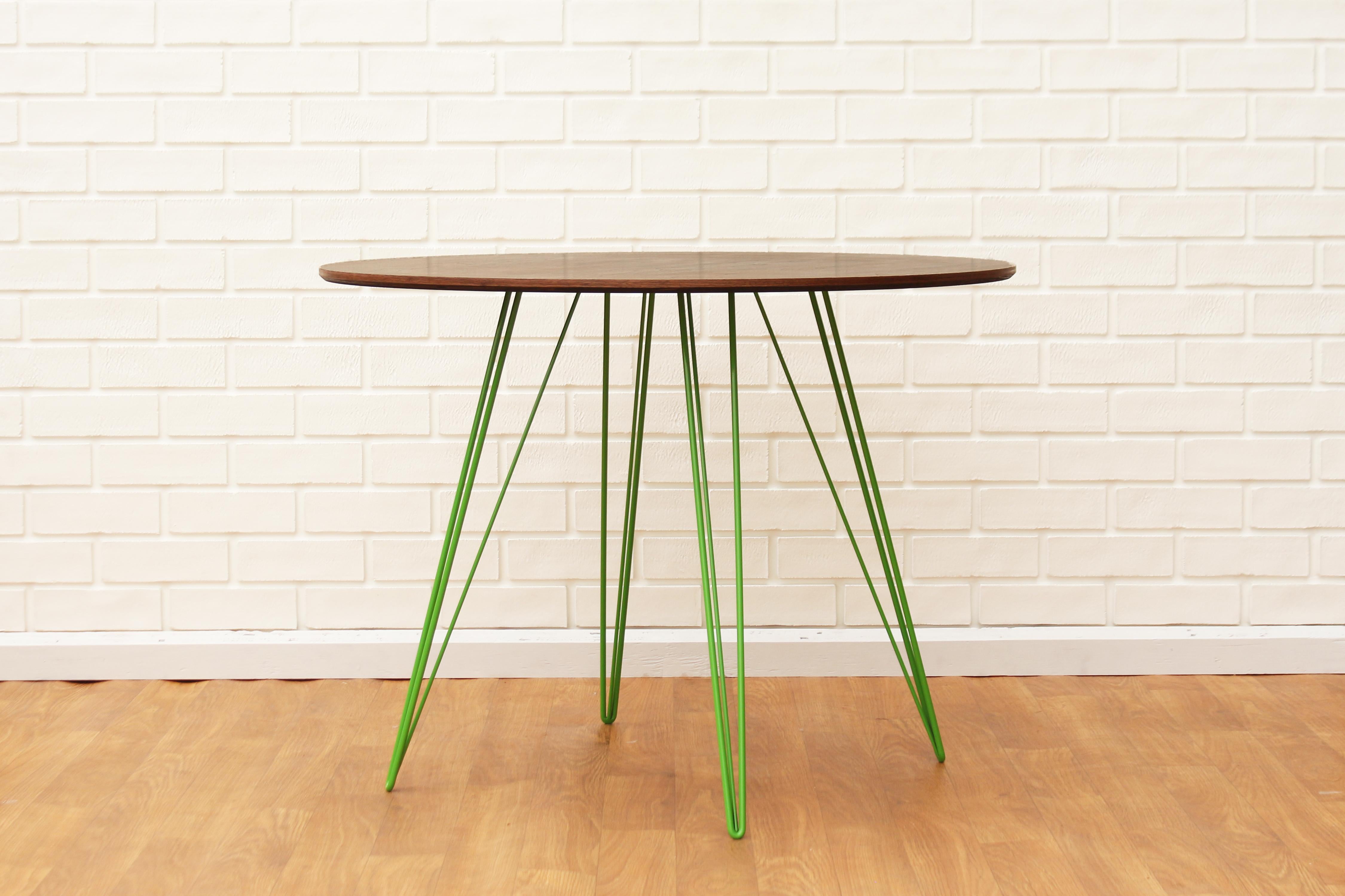 A thin, elegant and light table that can be customized to any shape, size and color desired. This handcrafted item perfectly blends industrial hairpin legs with a beveled wooden top. The irregular beauty of its natural wood combined with its simple