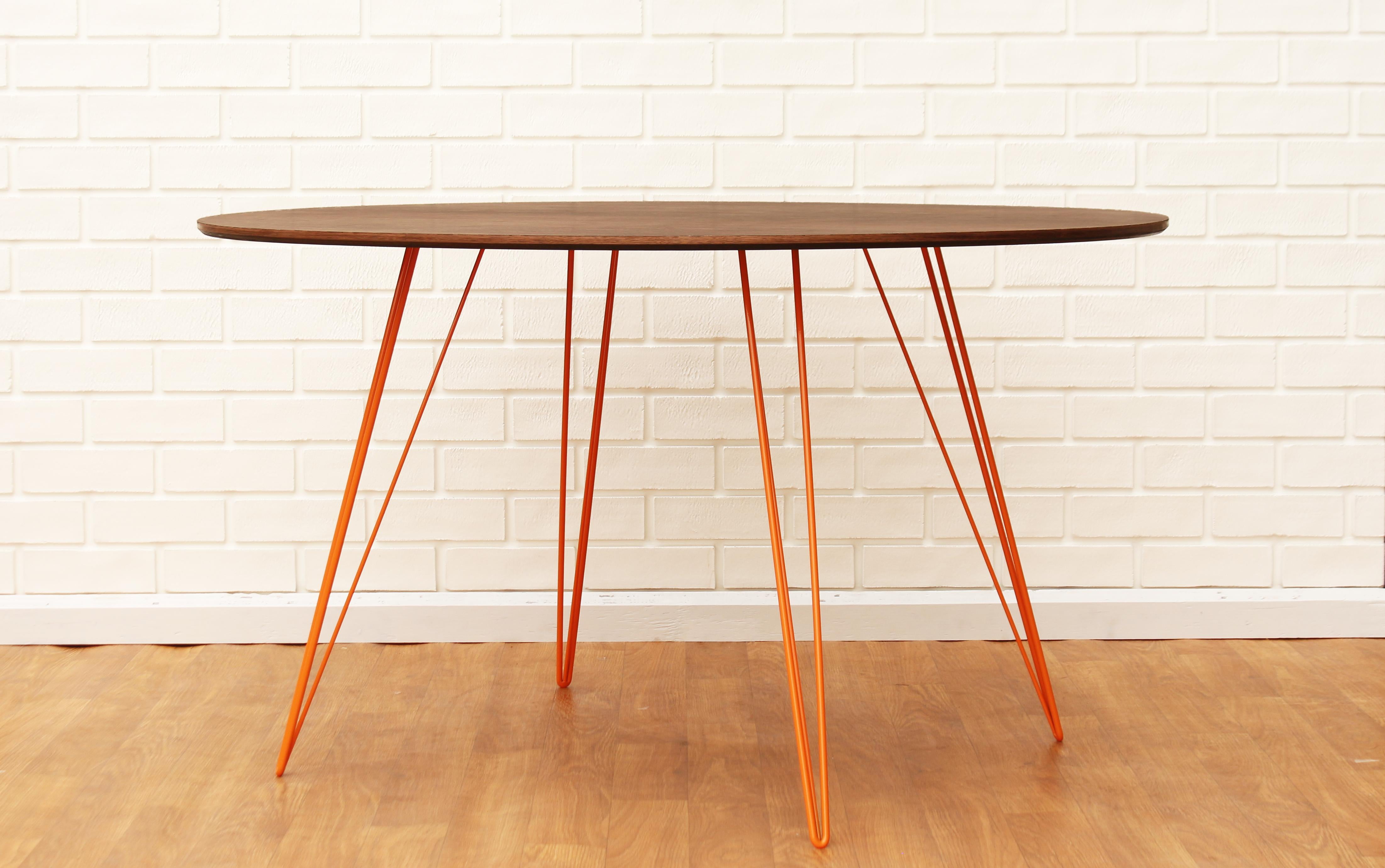 A thin, elegant and light table that can be customized to any shape, size and color desired. This handcrafted item perfectly blends industrial hairpin legs with a beveled wooden top. The irregular beauty of its natural wood combined with its simple
