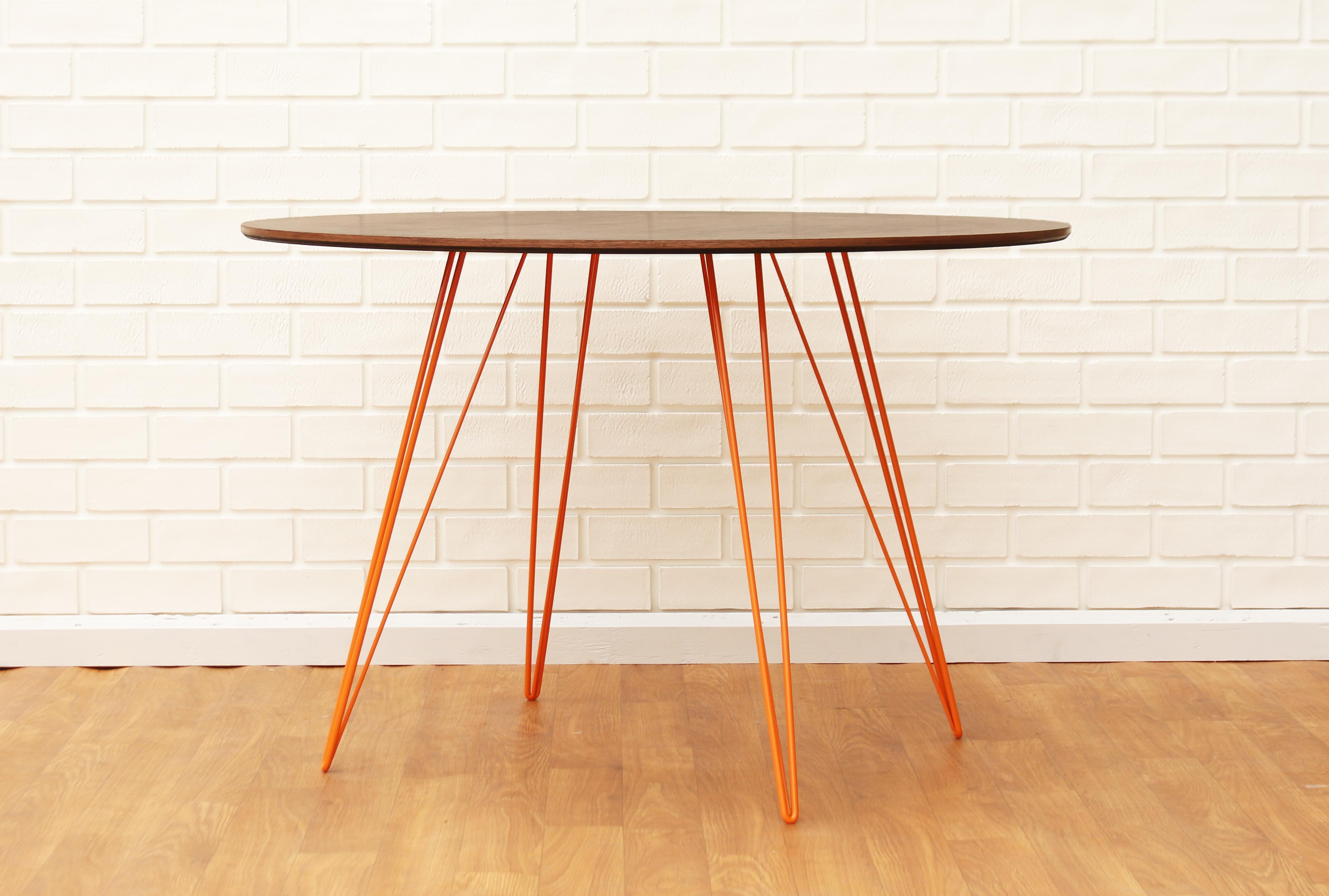 A thin, elegant and light table that can be customized to any shape, size and color desired. This handcrafted item perfectly blends industrial hairpin legs with a beveled wooden top. The irregular beauty of its natural wood combined with its simple