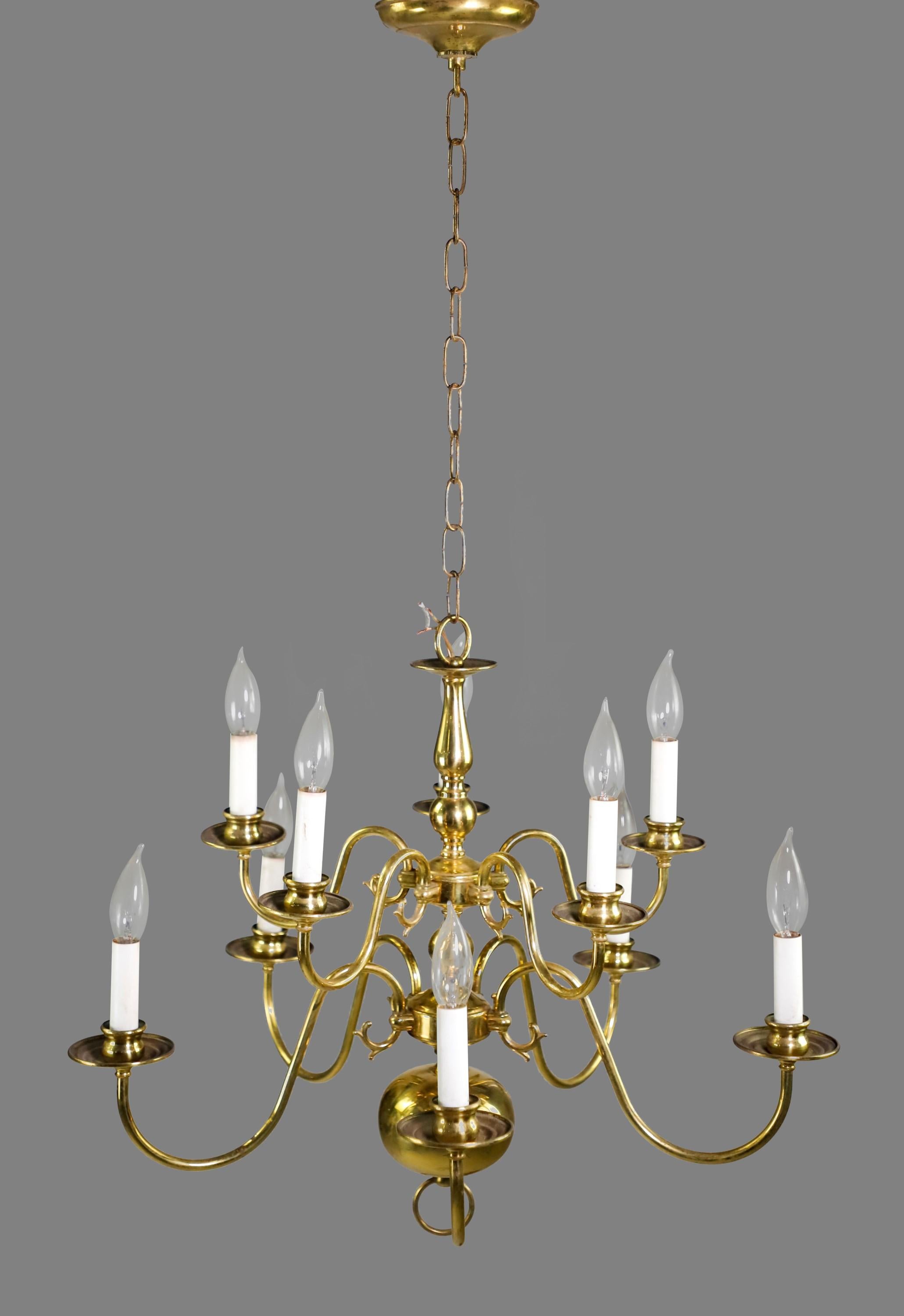 20th century Polished brass chandelier done in a Williamsburg style. Two layers of lights. Five lights each for a total of ten lights. Takes normal household Candelabra style lightbulbs. Cleaned and restored. Please note, this item is located in our
