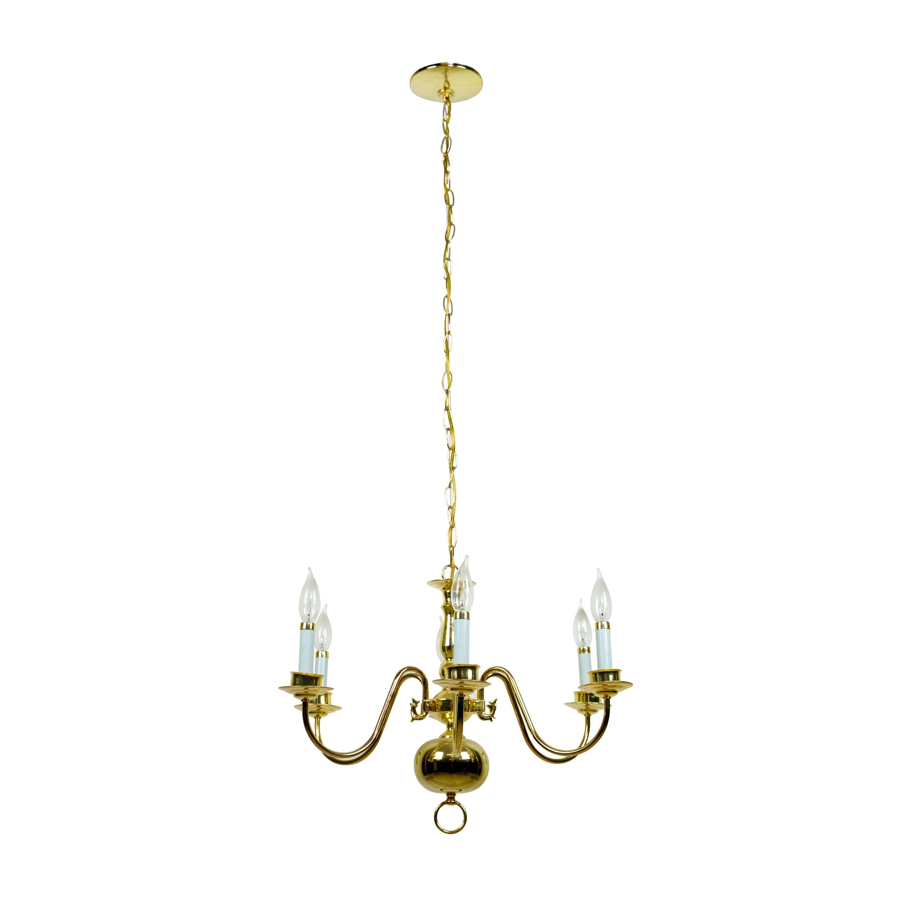 Williamsburg six arm steel chandelier with a polished brass finish. Cleaned and restored. Please note, this item is located in our Scranton, PA location.