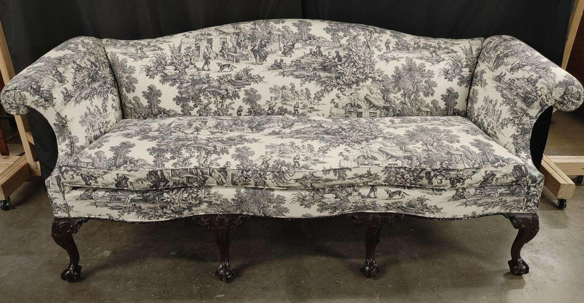 Stickley Furniture, Chippendale / Rococo Style upholstered camelback sofa by Stickley Furniture; Part of the Williamsburg Reserve Collection.
Sofa is upholstered in a beautiful toile fabric. Mahogany wood cabriole legs with ball and claw feet.