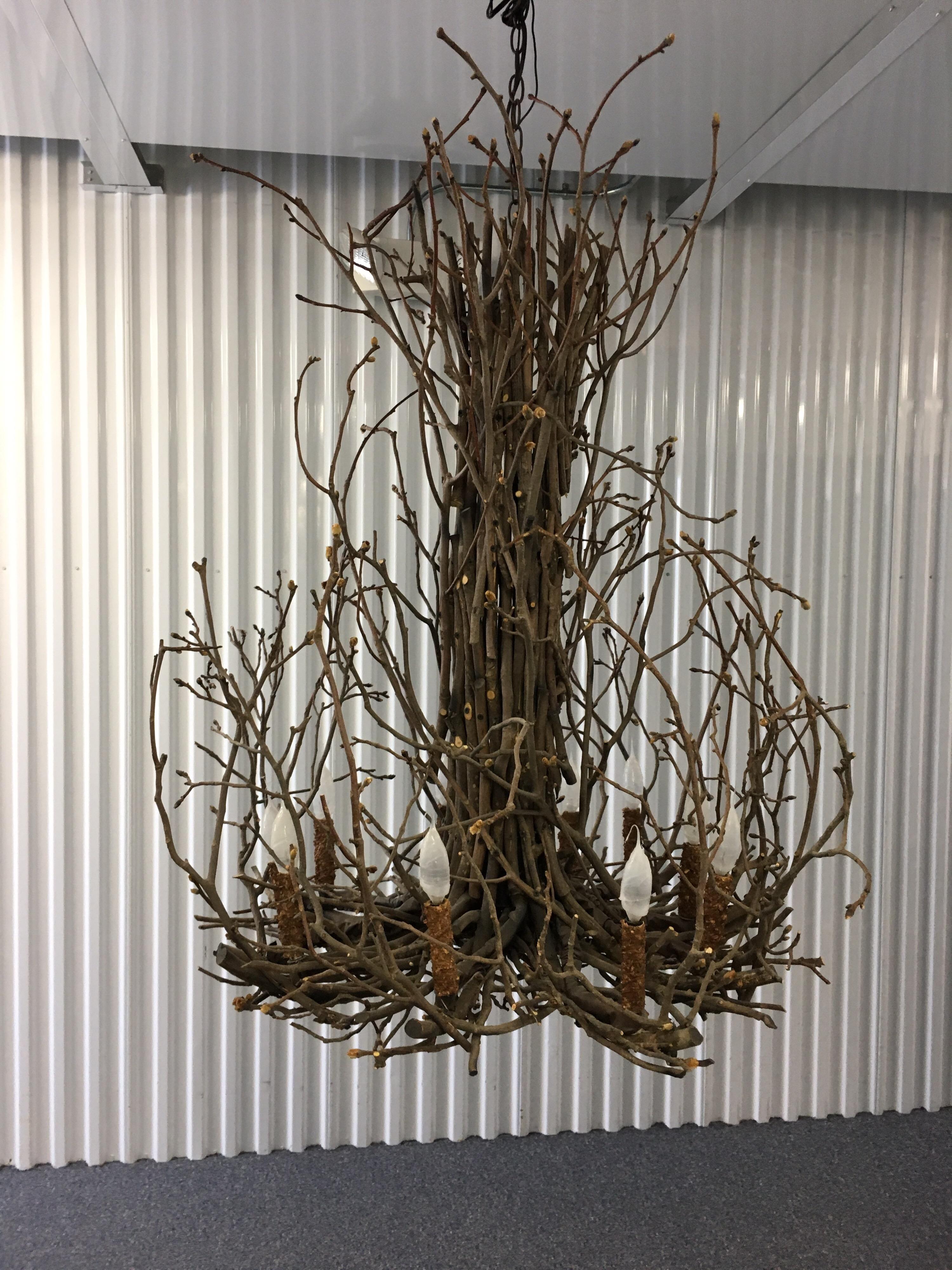 Willow twig branch eight-arm chandelier, handmade in Hudson, NY. Some breakage to some twig branches. Otherwise great centerpiece chandelier for a rustic look.
Measures: 47