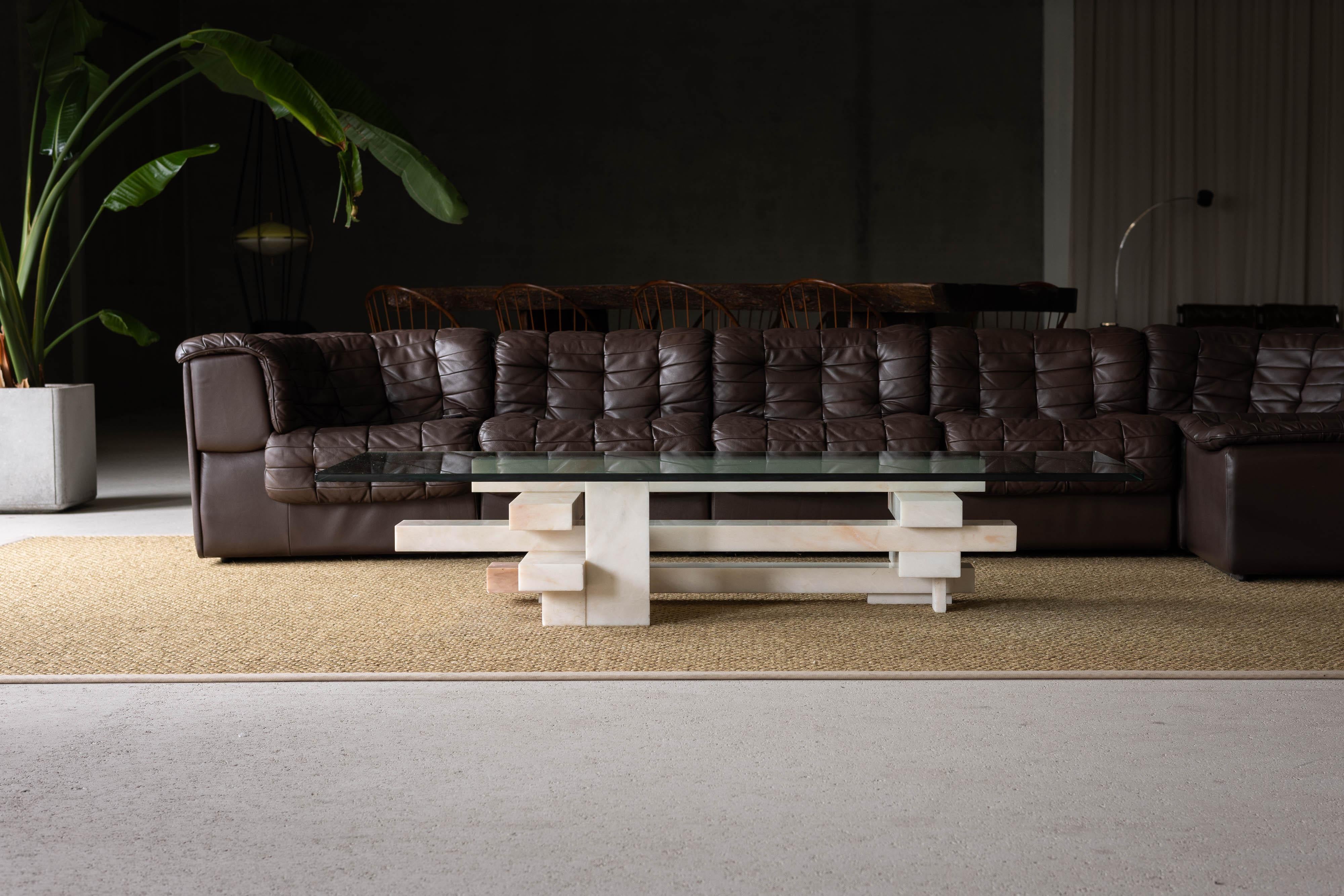 This coffee table designed by Willy Ballez, is crafted in his own atelier in Belgium in 1979. It stands as a truly remarkable piece that embodies the inspiration of Constructivist design. Known for his innovative use of materials and bold