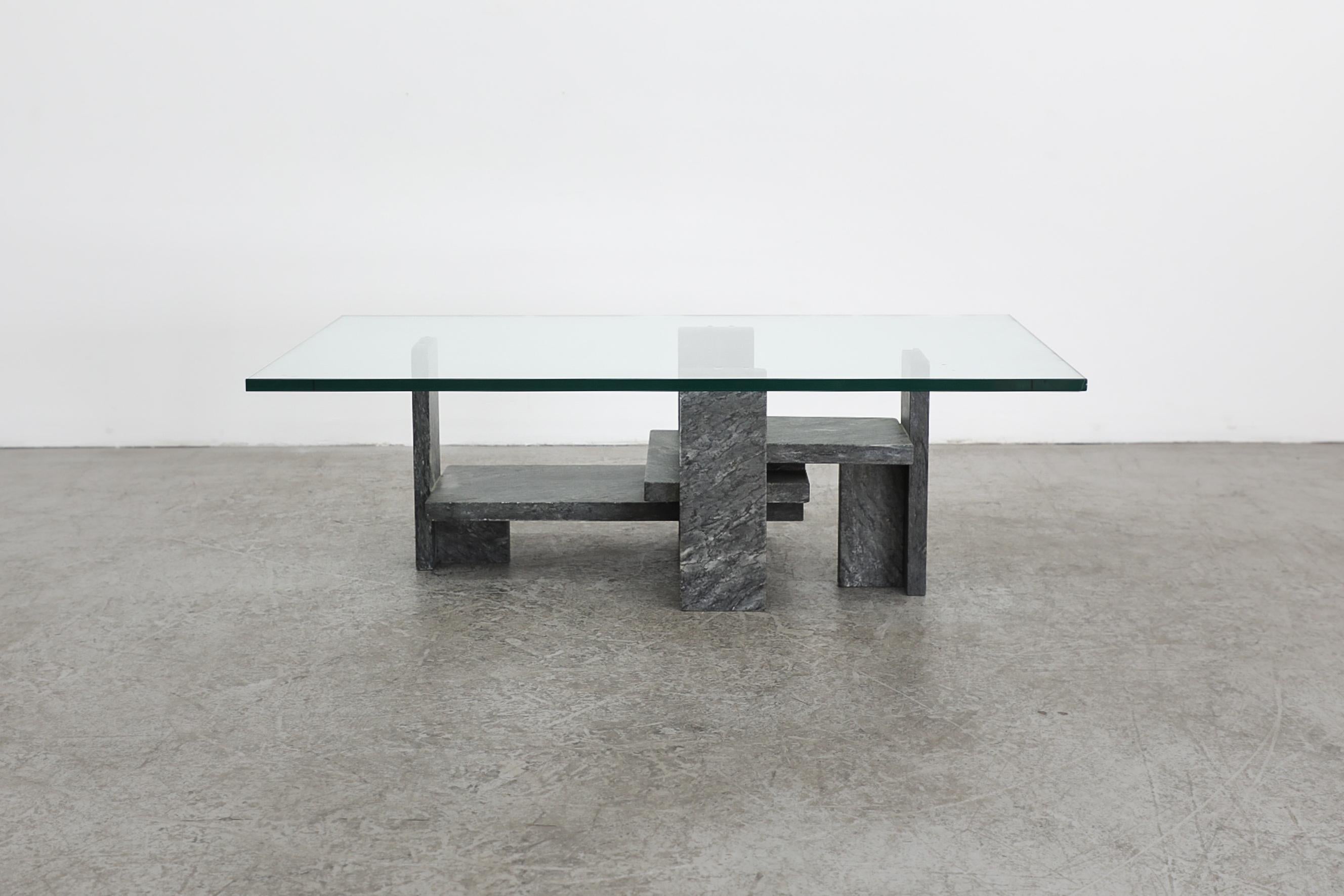 Modernist sculptural marble and plate glass coffee table by Belgian artist and architect Willy Ballez, 1970's. Ballez was a renowned sculptor and designed some highly architectural tables, working mostly in granite or travertine. In original