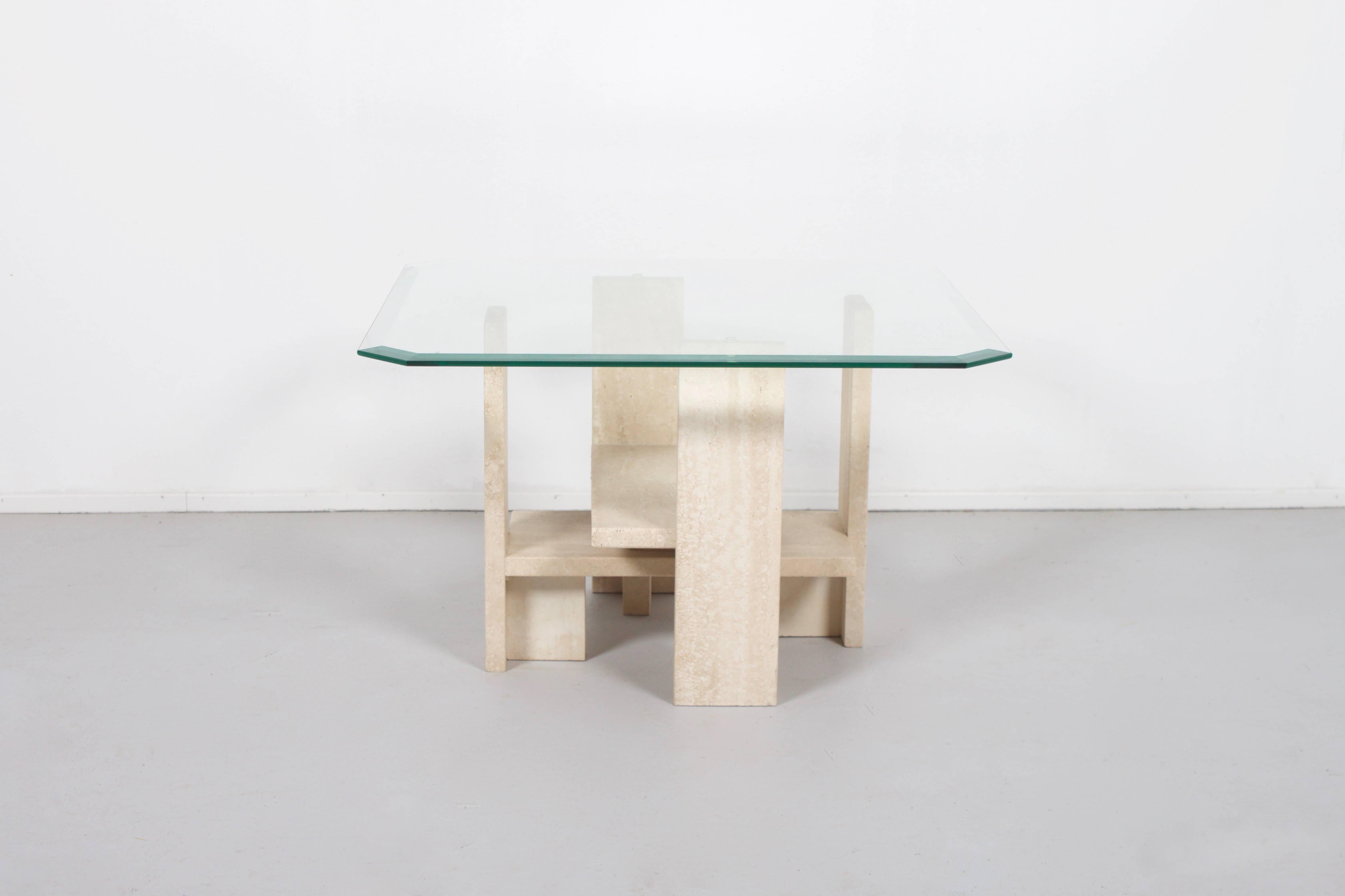 Sculptural end table by Willy Ballez in excellent condition.

Handmade in Belgium in the 1970s.

The abstract base is made from solid travertine.

The top is made of glass. 

We offer a variety of insured shipping services, ask us for the