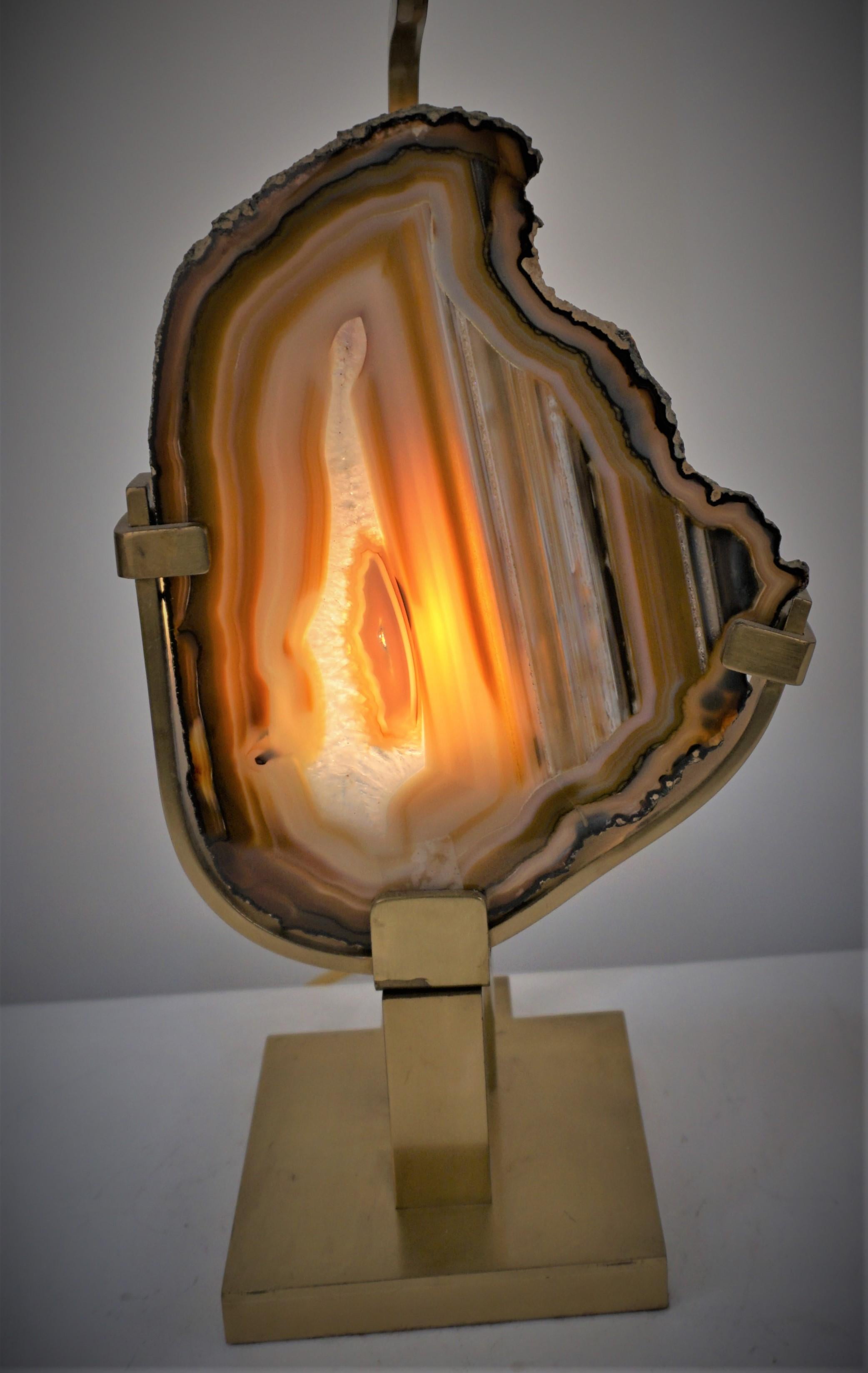 An elegant table lamp with a big piece of agate stone as night light as well as upper light and square lampshade.
Measurement includes the lampshade.