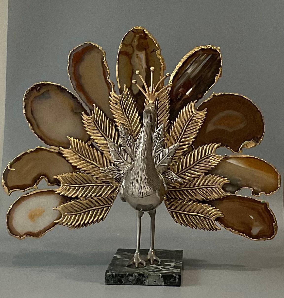 Amazing peacock sculpture attributed to Willy Daro. Great agate stone feathers surrounded by gilt metal. The combination or the metal and the stone on the marble base makes this a truly beautiful and desirable sculpture that would enhance any