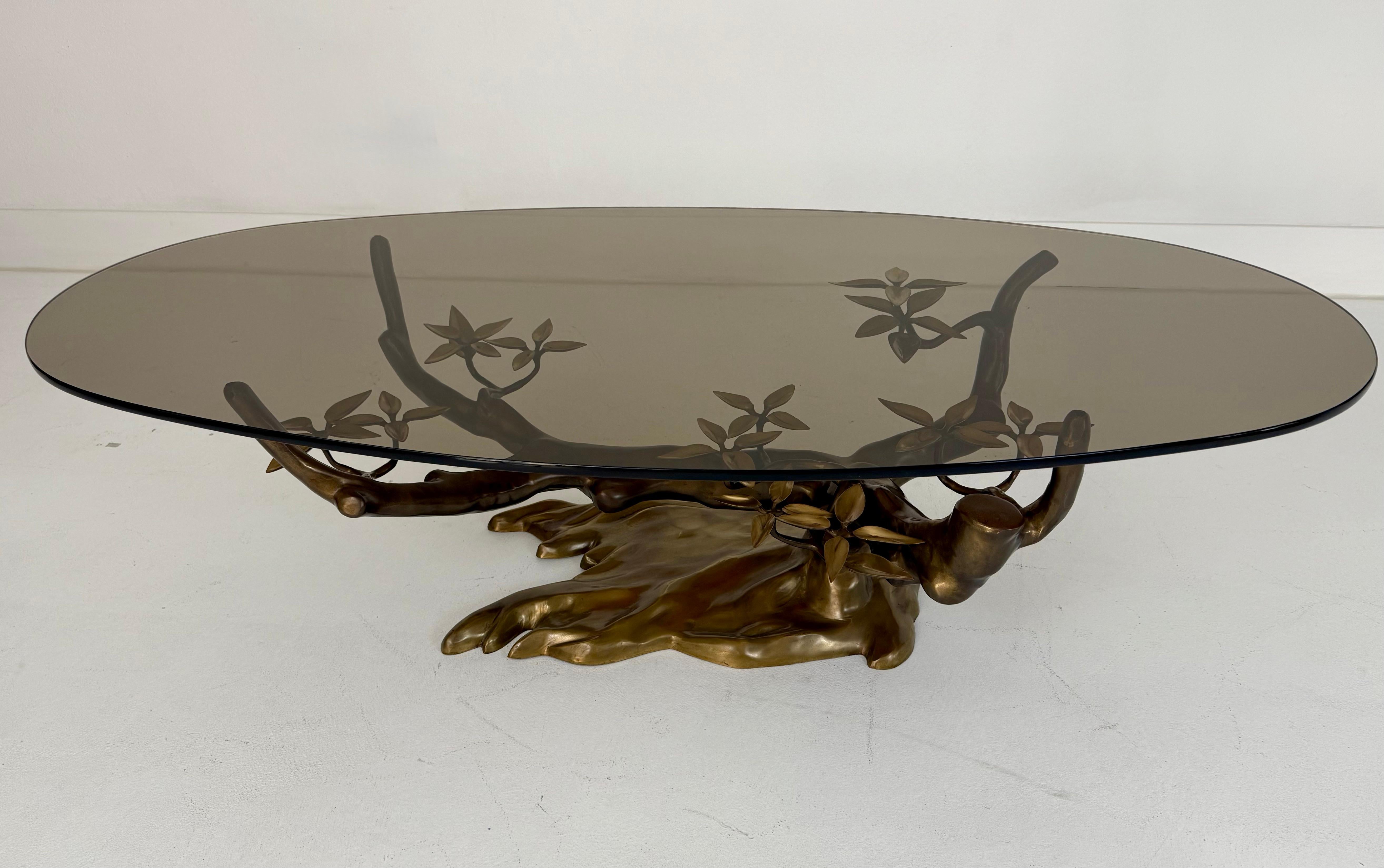 An exceptional and rare Bonsai cocktail table by Belgian designer Willy Daro, dating to the 1970s. This sculptural table features a hand-cast patinated brass base in the form of a stylized bonsai tree, complete with intricate branches and leaves,