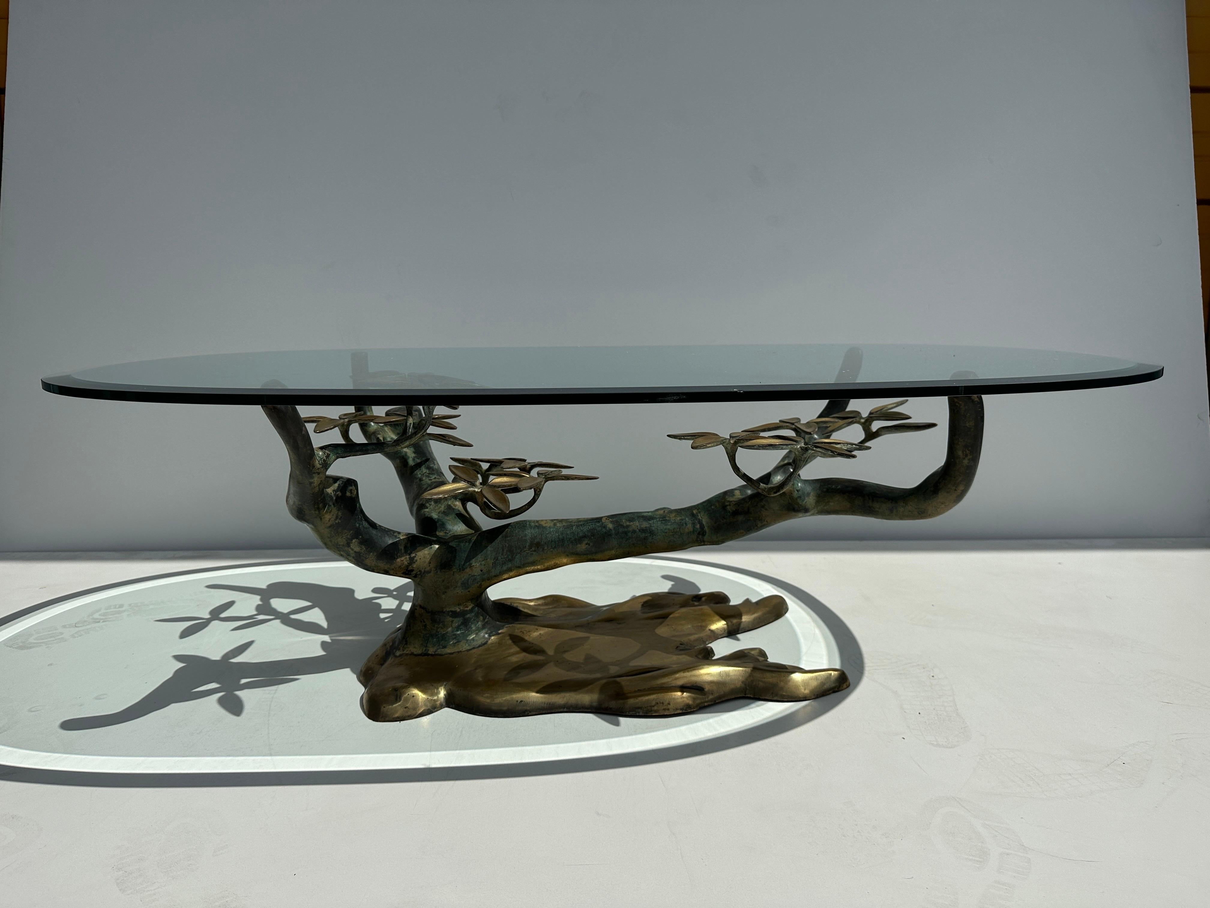Willy Daro brass bonsai tree coffee table in two tone patina finish. Tree base is 36” x 24” and 15.5” high. Glass top is 51” x 32” and has a few tiny chips on edges.