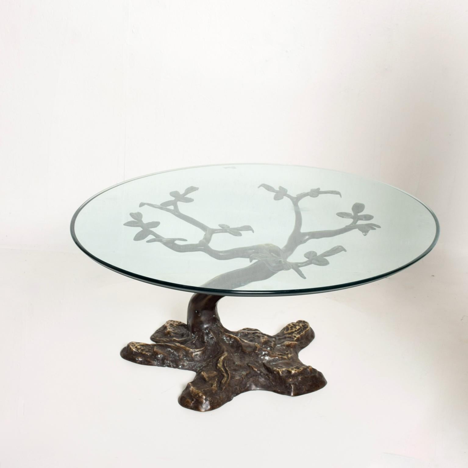 We are pleased to offer for your consideration a beautiful bronze coffee table designed by Willy Daro. Beautiful bonsai tree in cast bronze sculpture with round glass top. Dimensions: 32