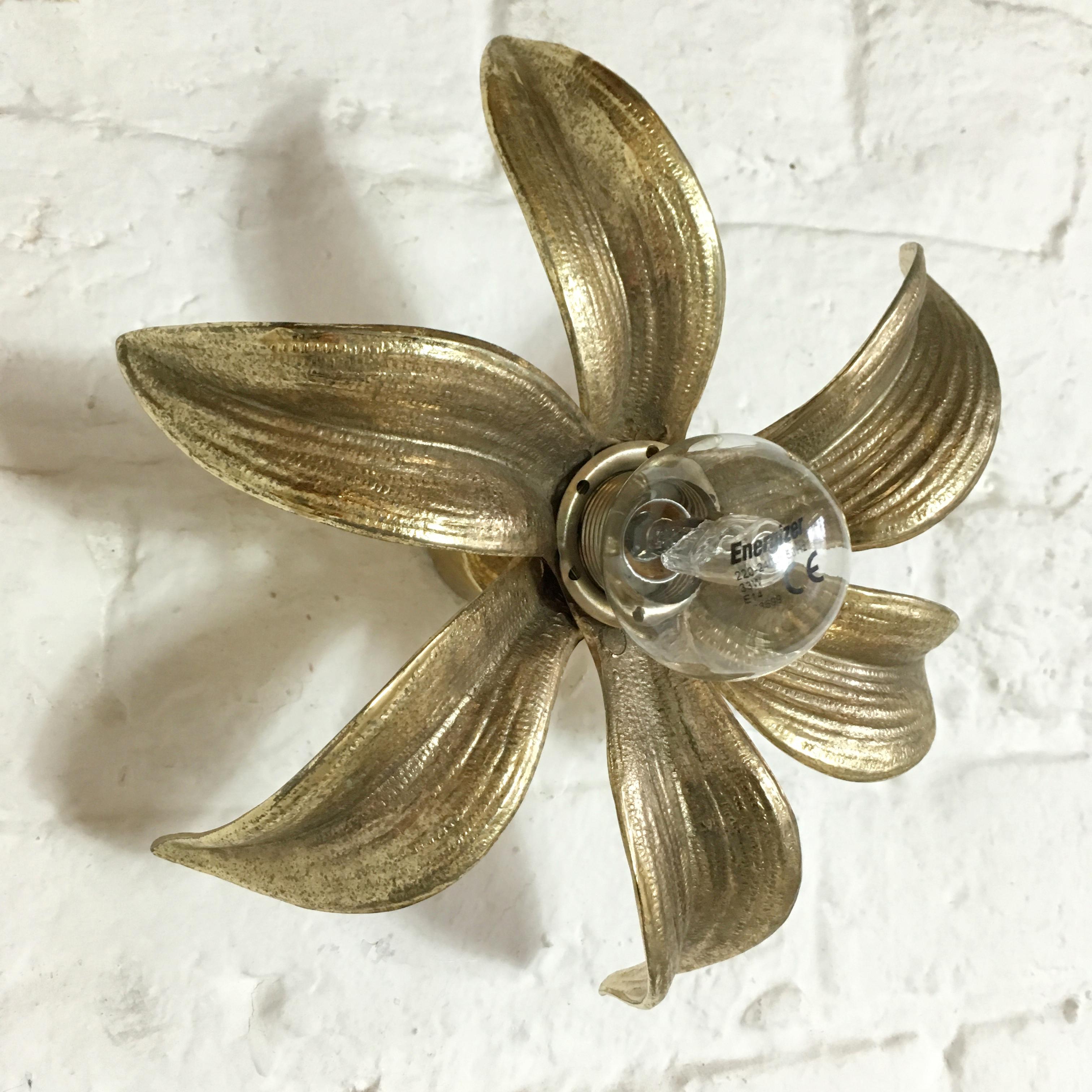 Willy Daro flower light for ‘Massive' 1970s. Cast brass flower wall or ceiling light, the light attaches by a plate so can be used either way. The light is wired and in full working order, but as with all our lighting we would always suggest it is