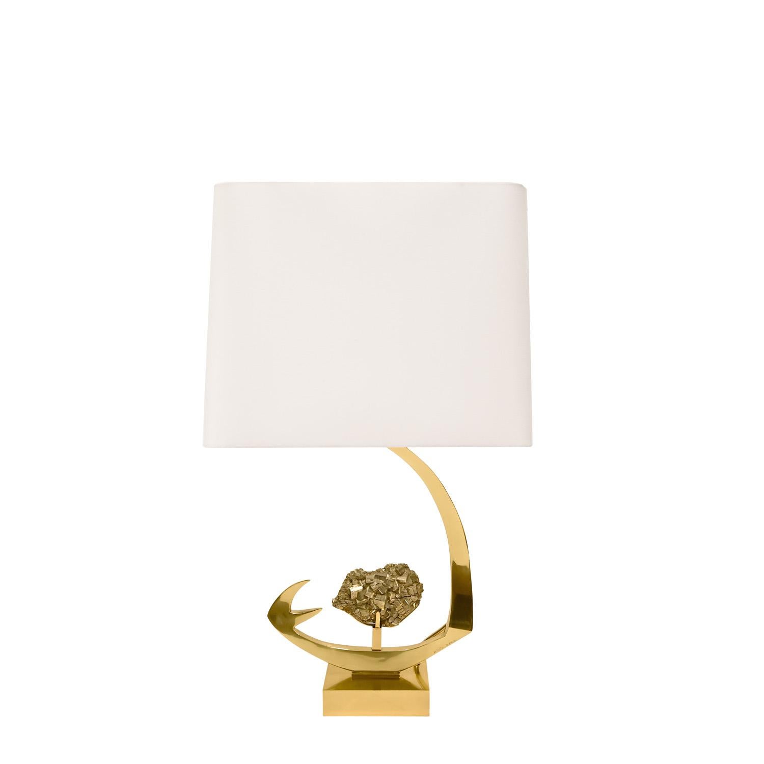 Sculptural table lamp in polished brass with mounted pyrite crystal by Willy Daro, Belgium 1970's (etched signature reads Willy Daro). This lamp is a stunning sculptural work of art.

W: 7 inches
D: 4 inches
H: 27 inches
Shade Diam: 18 inches
Shade